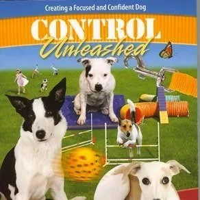 Book cover, subtitle: "creating a focused and confident dog", multiple dogs sitting or using agility equipment