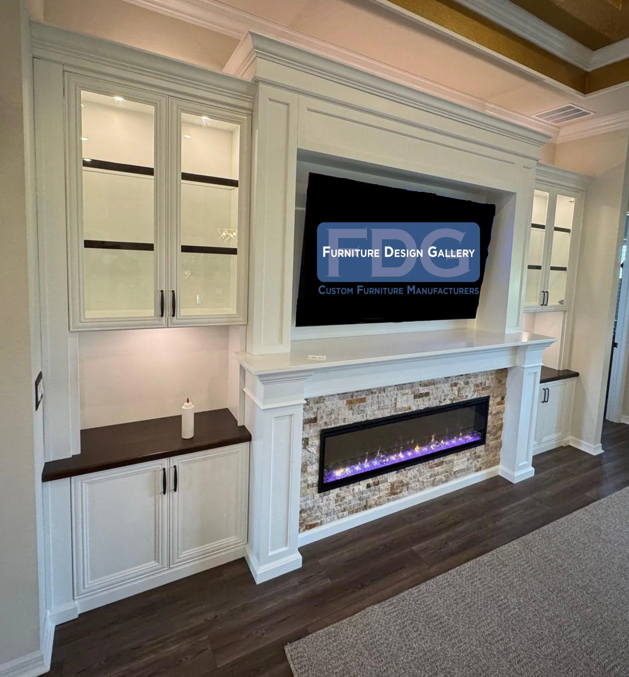 29. This elegant custom wall unit creates a stunning focal point with its traditional white cabinetry, glass-front display cases, and a beautiful stacked-stone fireplace surround.
