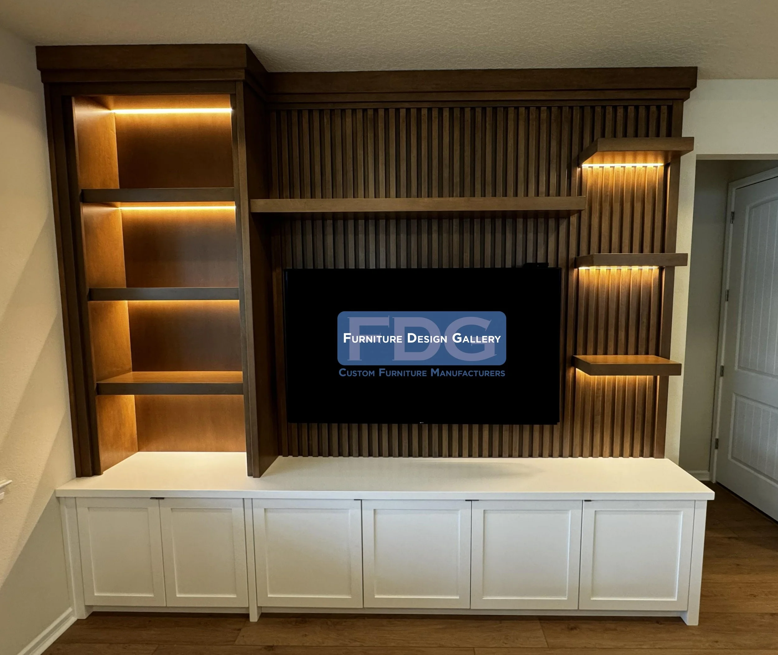 64. This custom wall unit strikes the perfect balance between modern design and functional storage. The rich wood tones and vertical slat backing pair beautifully with clean, white cabinetry, while integrated LED backlighting highlights your favorite