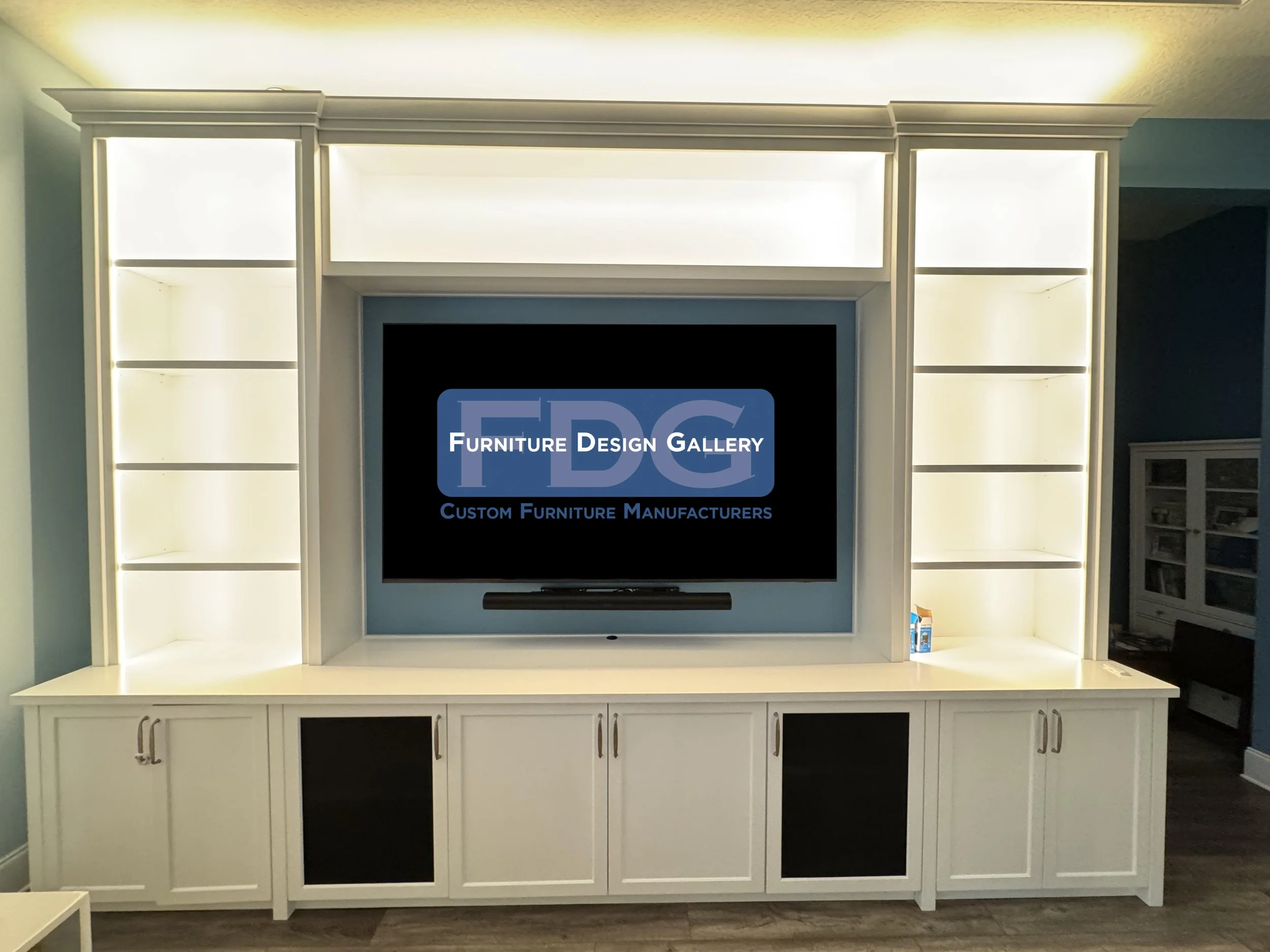 56. Elevate your living space with a custom entertainment center designed for both style and function. ✨ Modern lines, integrated lighting, and tailored storage—built to fit your home perfectly.
