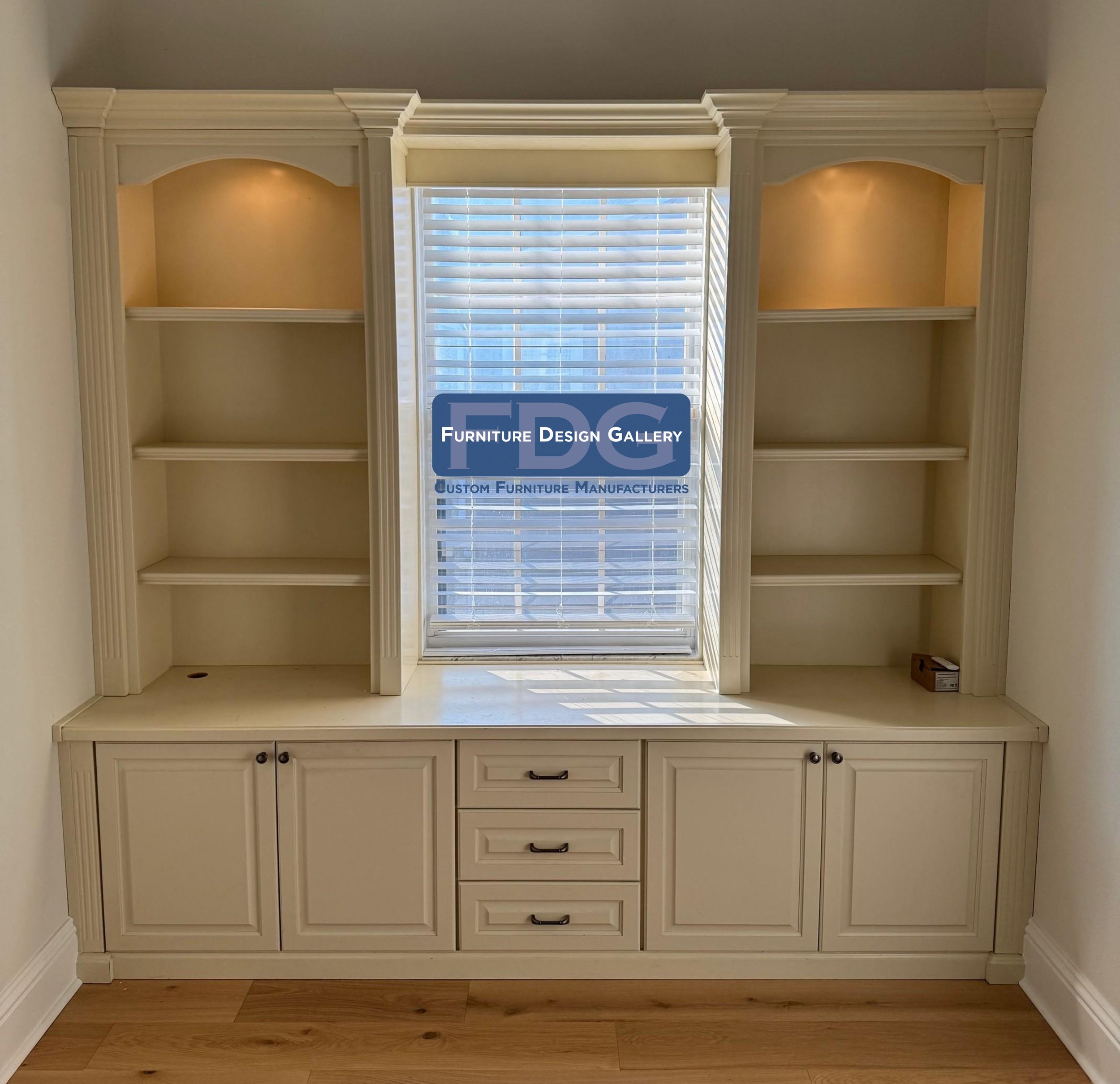 21.  Framing natural light with custom-built storage. This built-in unit features arched display shelving, warm integrated lighting, and plenty of lower cabinet and drawer space to keep things clean and organized.