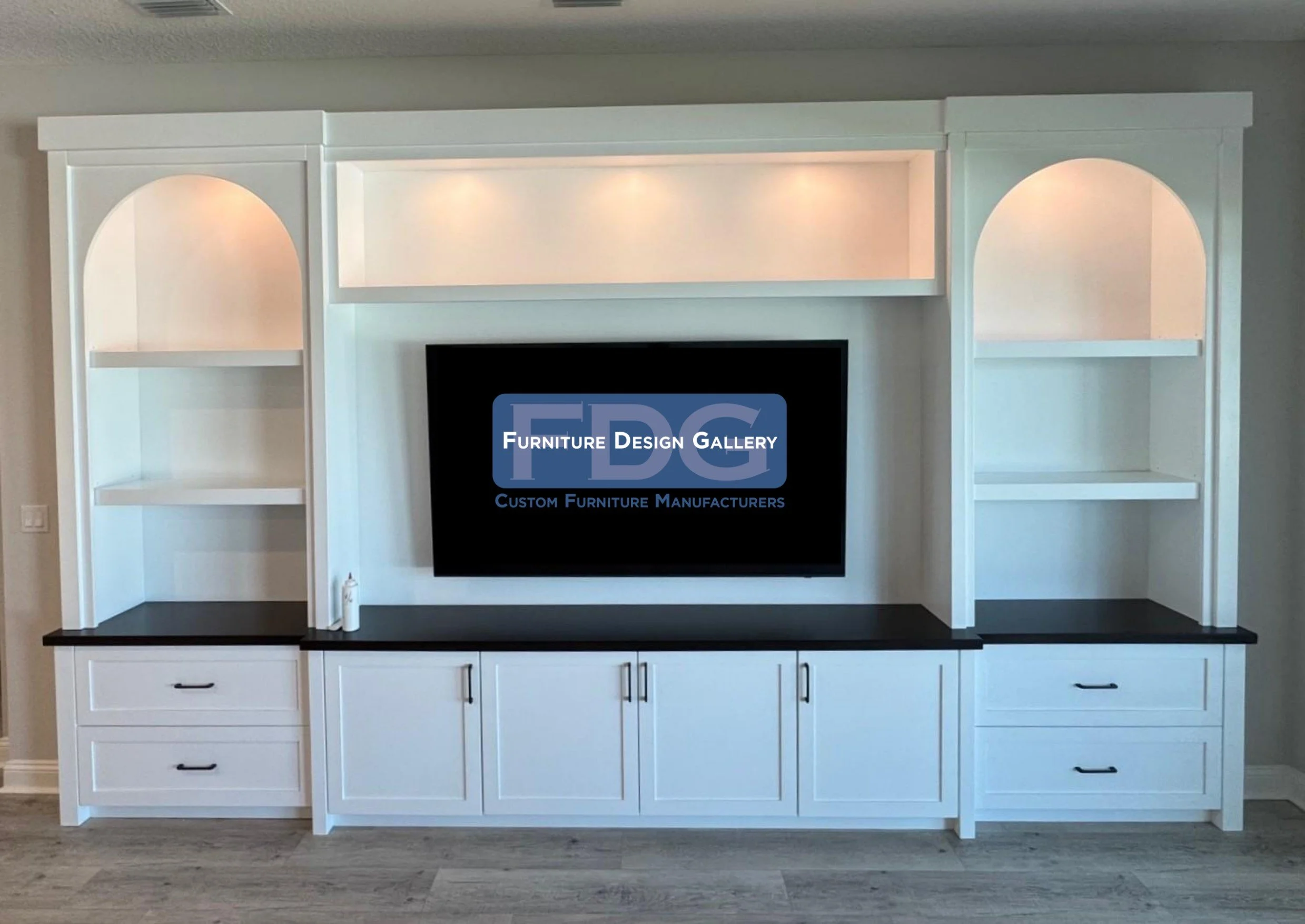 53. Architectural charm meets modern utility. This crisp white unit features beautiful arched shelving and warm integrated lighting, grounded by a dark, high-contrast countertop for a refined and balanced look.