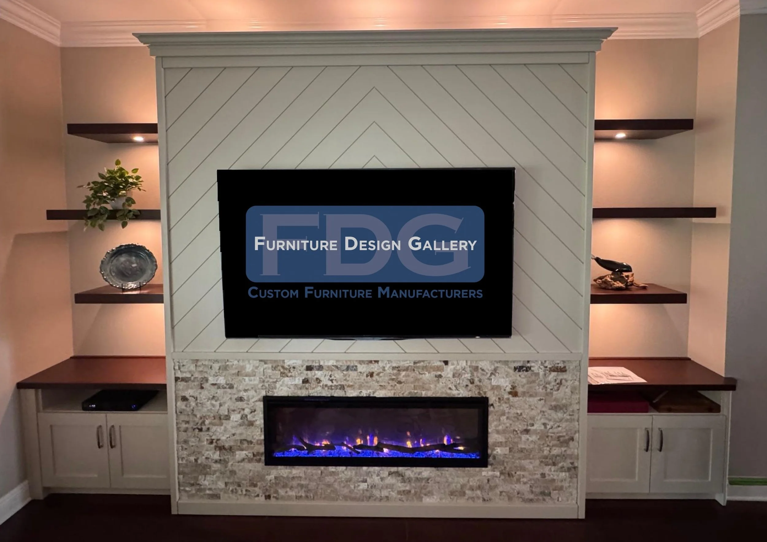 46. Elegant, balanced, and textural. This custom entertainment center features a chevron-patterned TV surround, a stacked-stone fireplace, and dark floating shelves with integrated lighting that create a warm, inviting atmosphere.