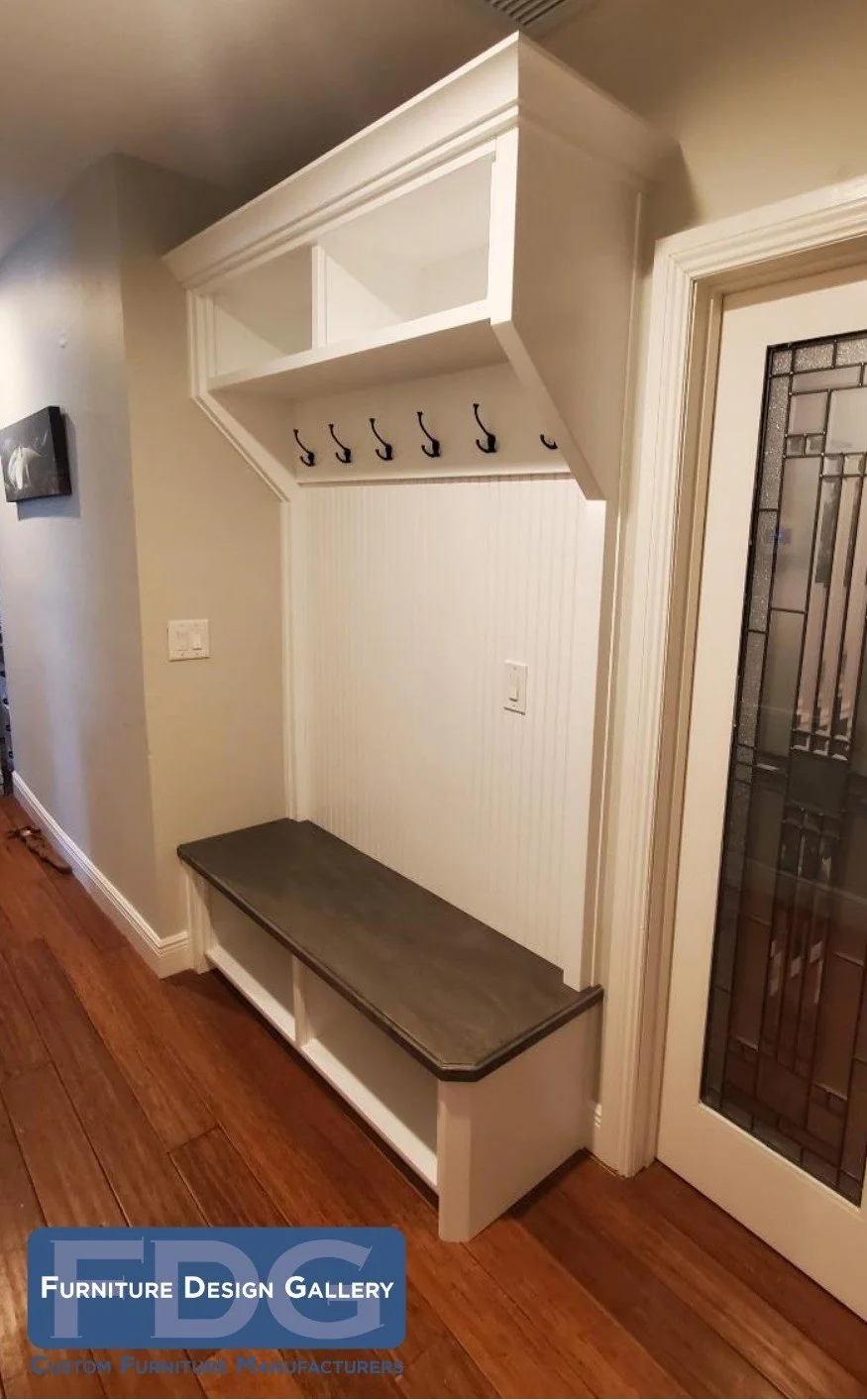 2. Small footprint, massive impact. 👟✨ This compact custom mudroom unit features classic beadboard, overhead cubbies, and a sleek wood-toned bench to keep your entryway organized and elegant.