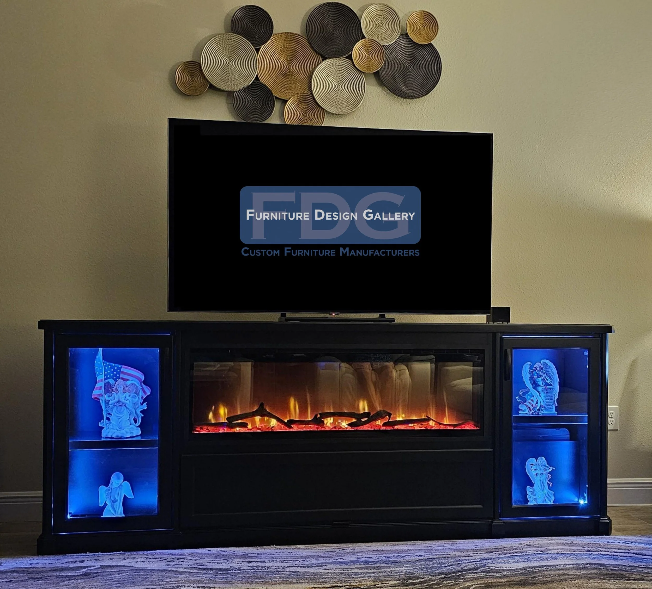 12. Sleek, bold, and atmospheric. This custom black console combines a linear fireplace with vibrant LED shelving to make every movie night an experience.