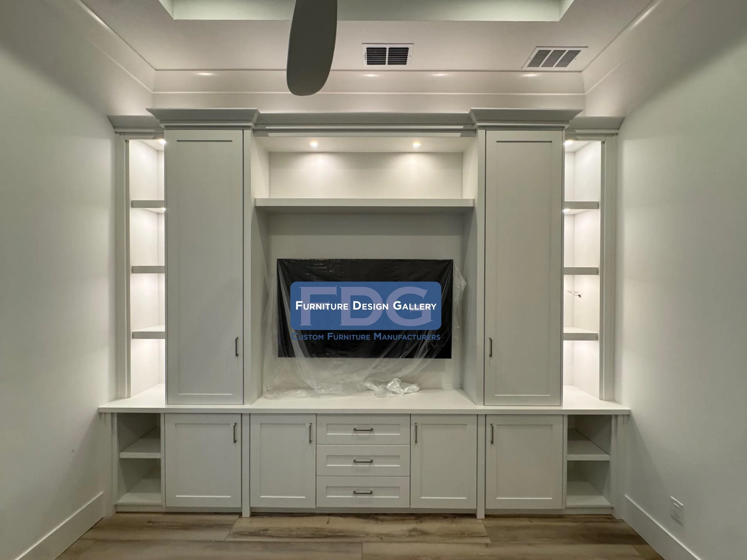 58. Bring timeless elegance to your home with a custom-built wall unit that balances sleek cabinetry and open shelving. A perfect blend of storage and sophistication, crafted to fit your space exactly.