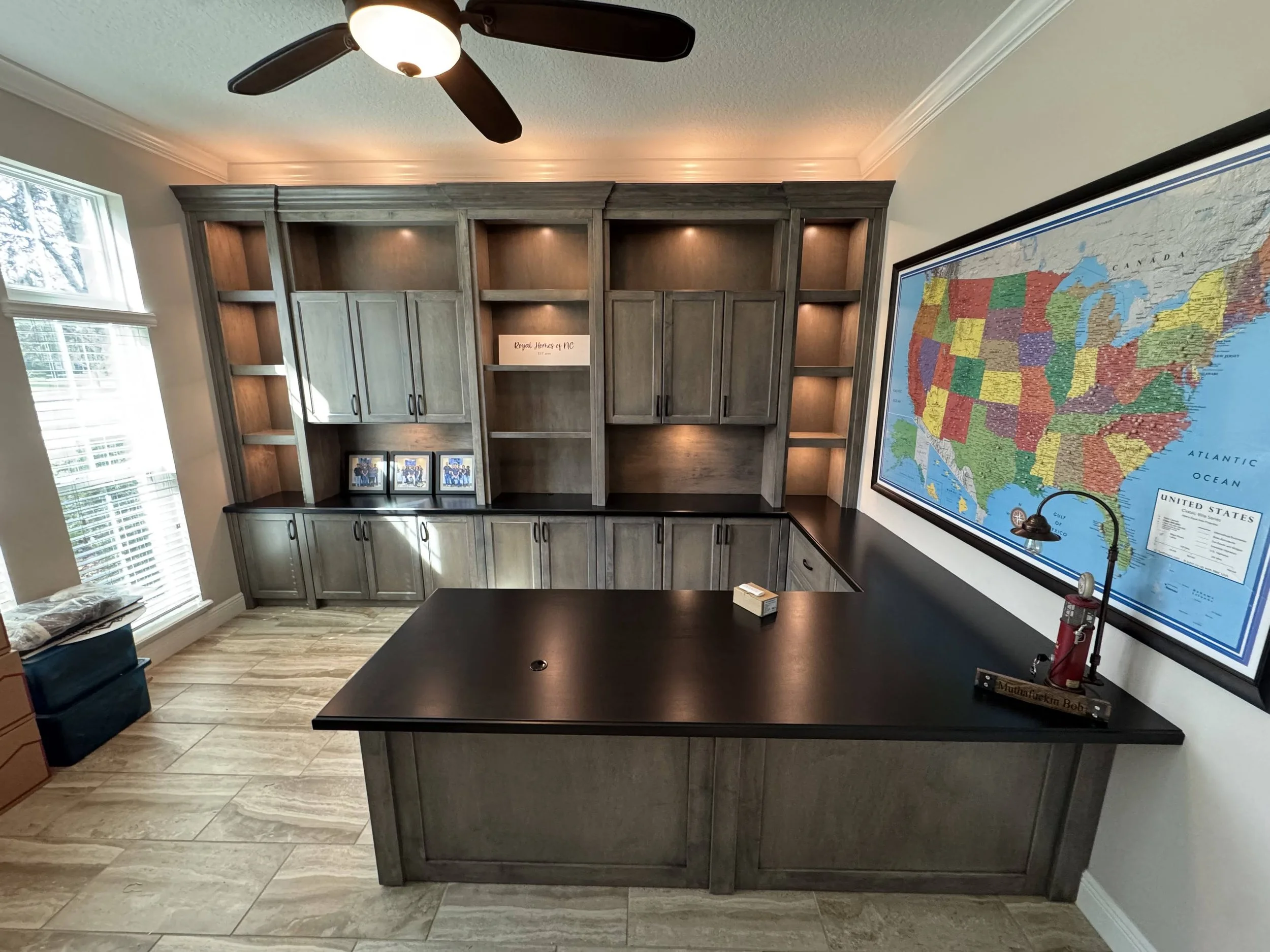 19. Sophisticated and functional: A custom-built executive suite featuring stained wood cabinetry and expansive wrap-around workspace.