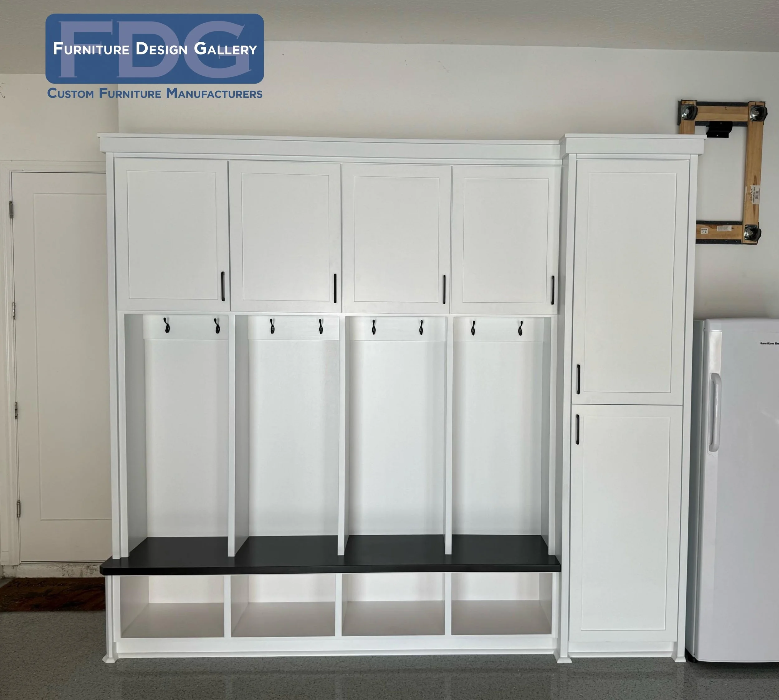 3. Maximize your garage or entryway efficiency with this heavy-duty, clean white mudroom unit. 🚗🧢 Featuring 4 dedicated lockers and a massive utility cabinet, it's designed to keep every piece of gear in its place.