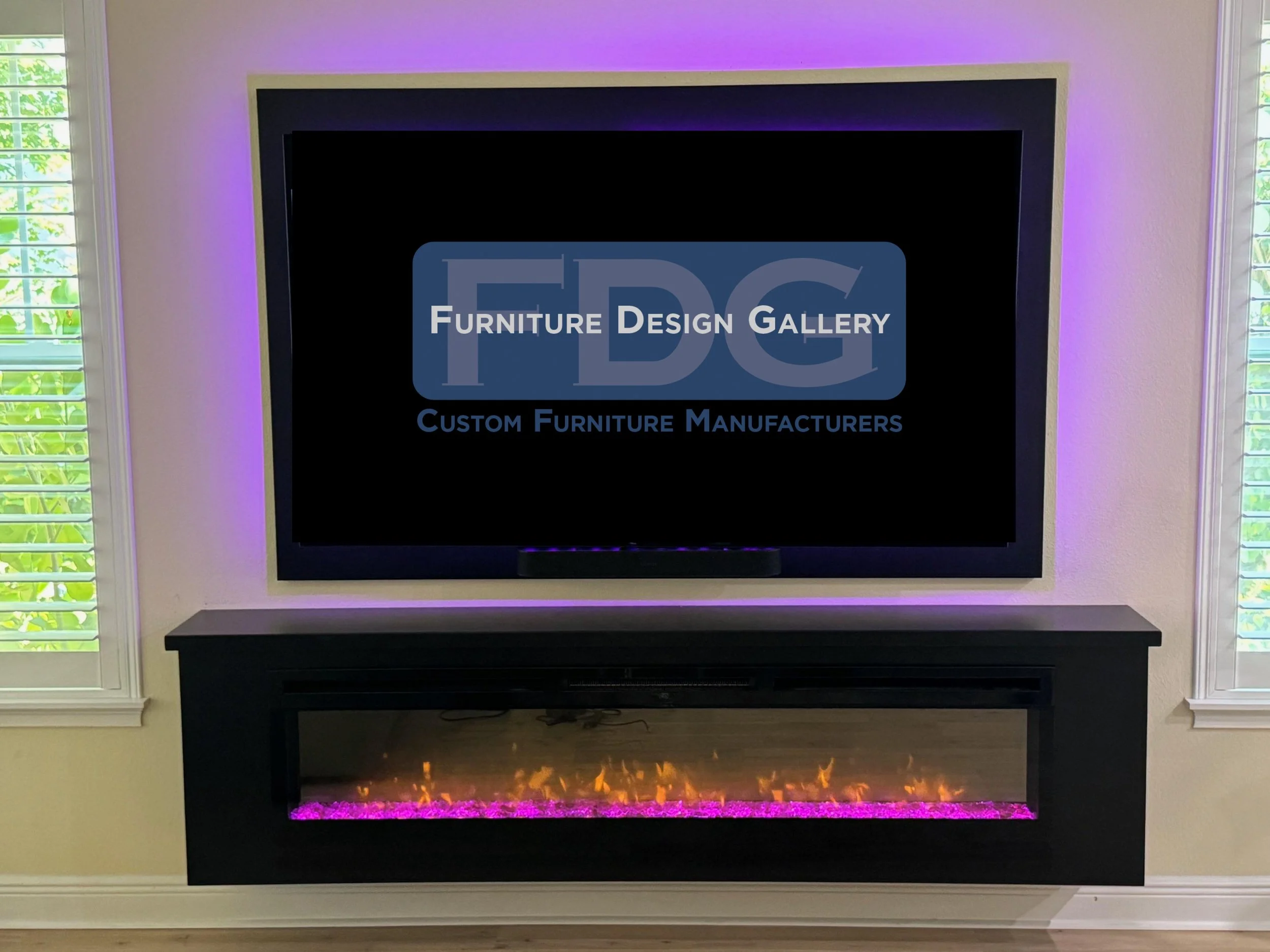 38. Modern, moody, and minimalist. This sleek black floating console and matching TV frame feature vibrant LED backlighting to create a stunning, cinematic focal point.