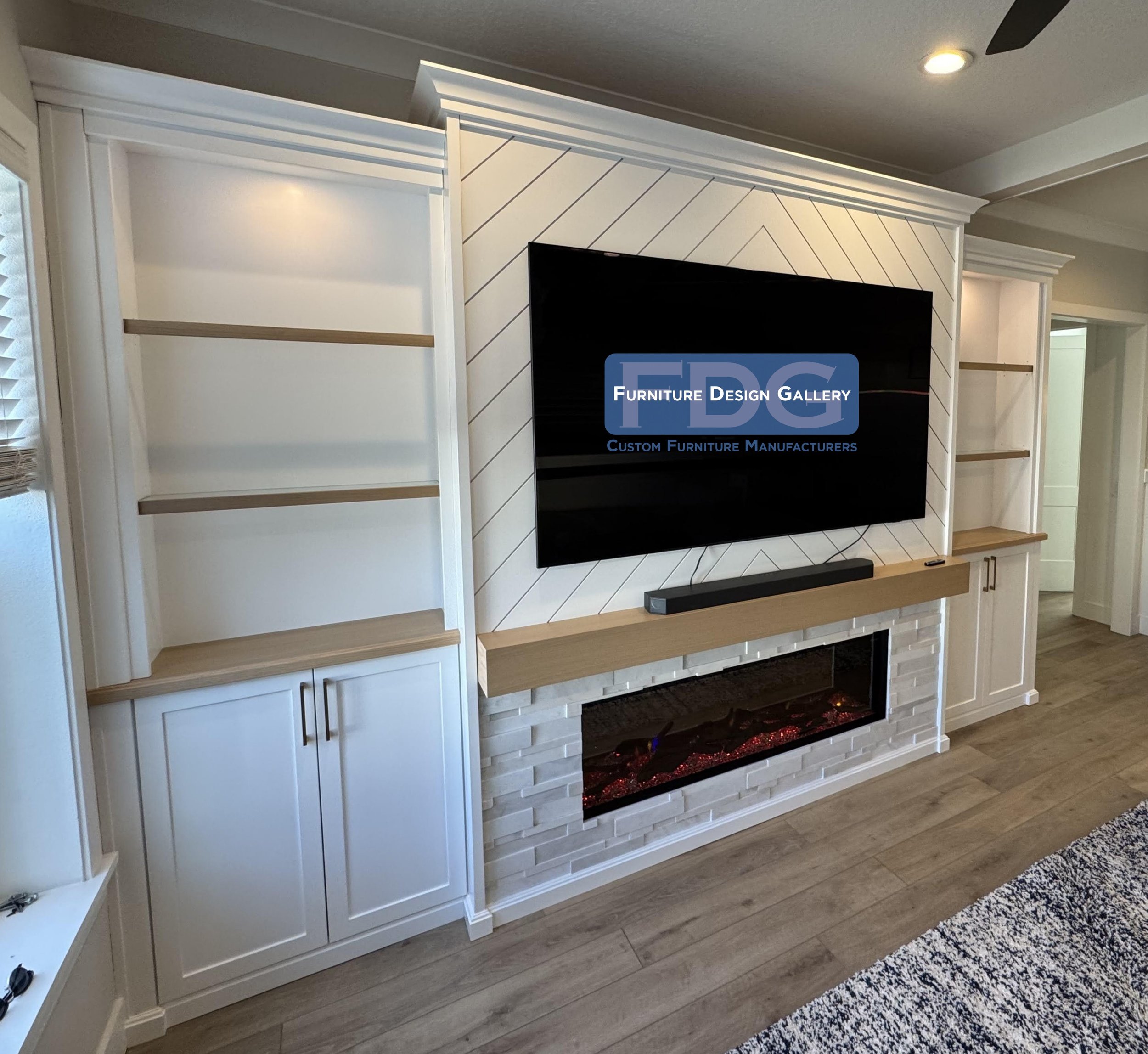 23. Modern farmhouse elegance at its finest, featuring a chevron-patterned backdrop, natural wood accents, and a stone-clad electric fireplace for a bright and inviting living space.