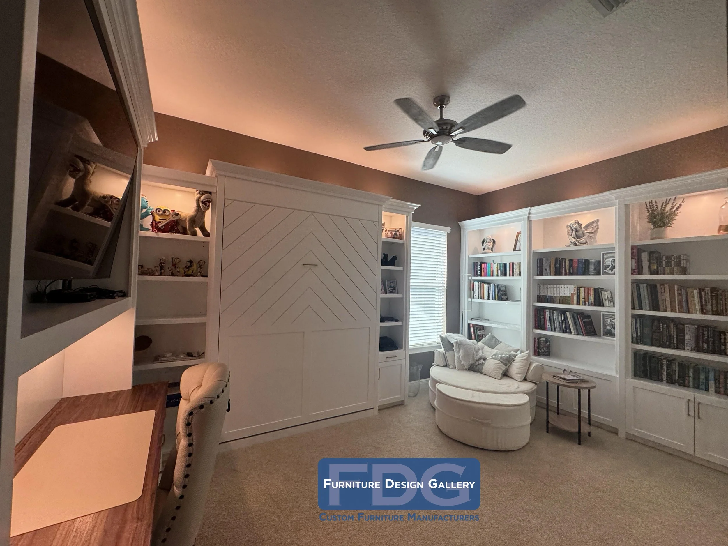 22.  All-in-one home office and guest sanctuary featuring fold-down wall bed, floor-to-ceiling library shelving, and warm LED accent lighting.