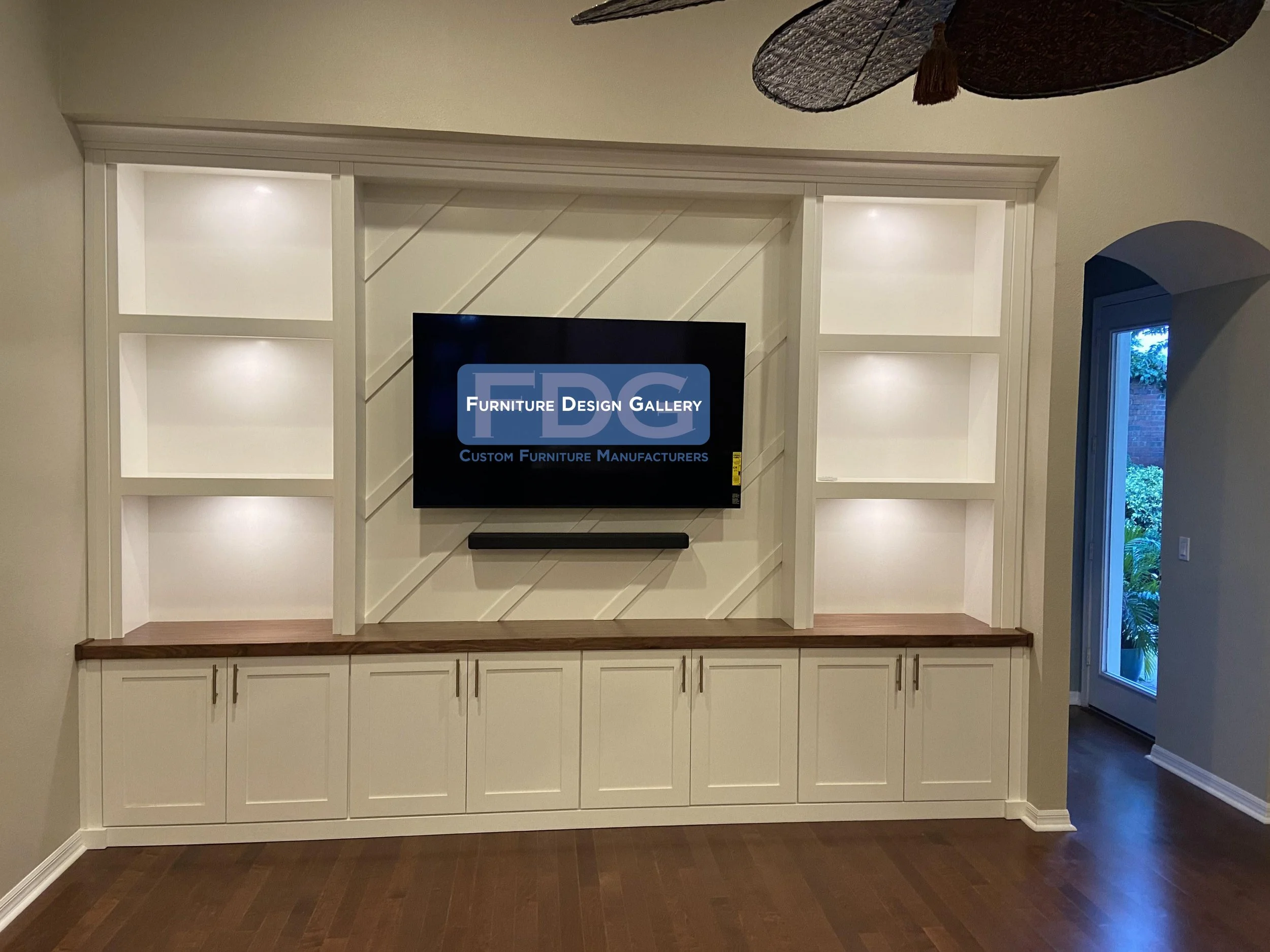 20. Make a bold statement with diagonal slat detailing and warm wood-toned accents. 📐✨ This custom wall unit combines architectural texture with functional storage to create a truly one-of-a-kind living space.
