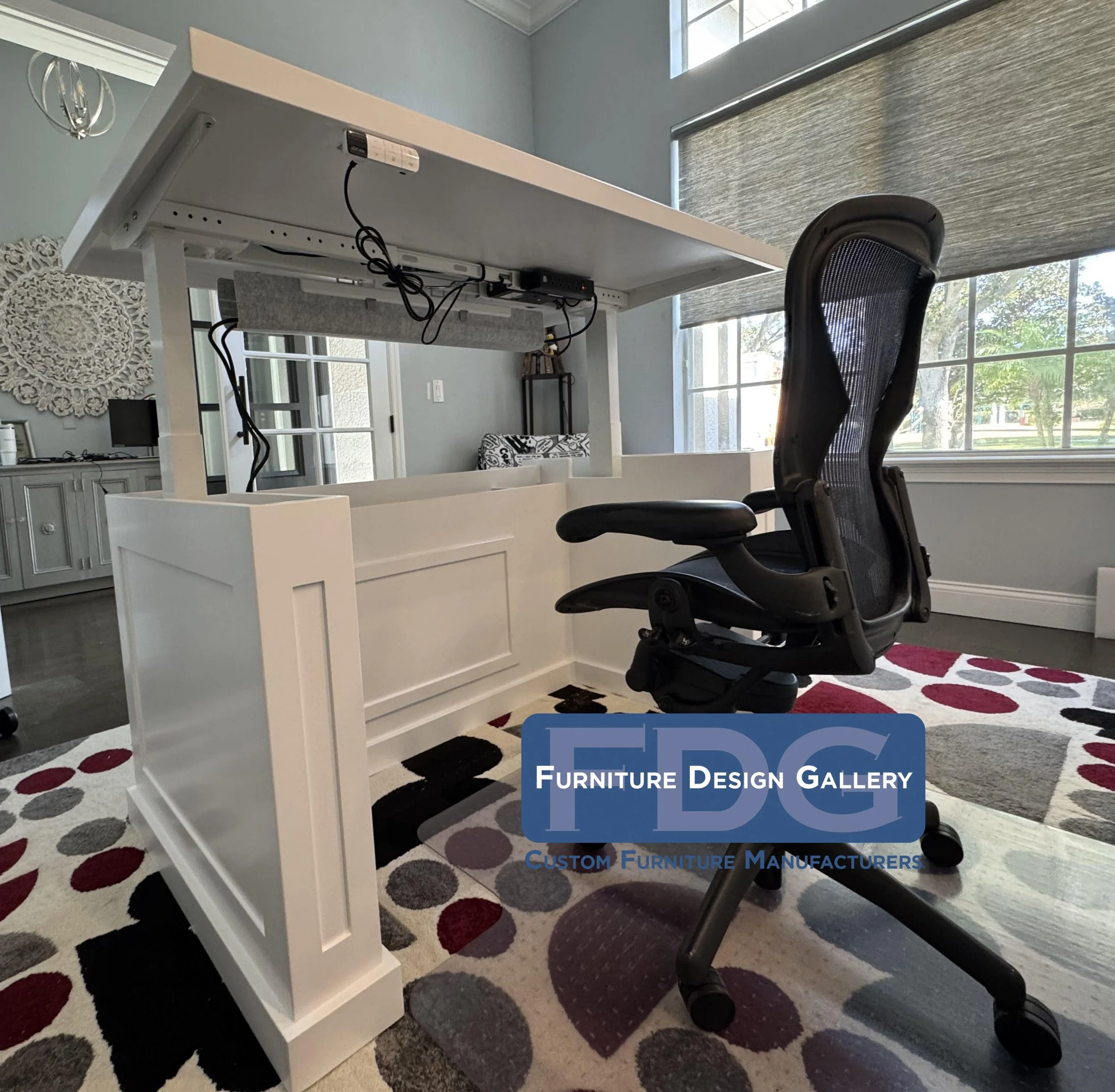 25.  Classic style meets modern ergonomics. This custom white executive desk features an integrated motorized sit-stand lift, giving you the health benefits of a standing desk without sacrificing a polished, traditional look.
