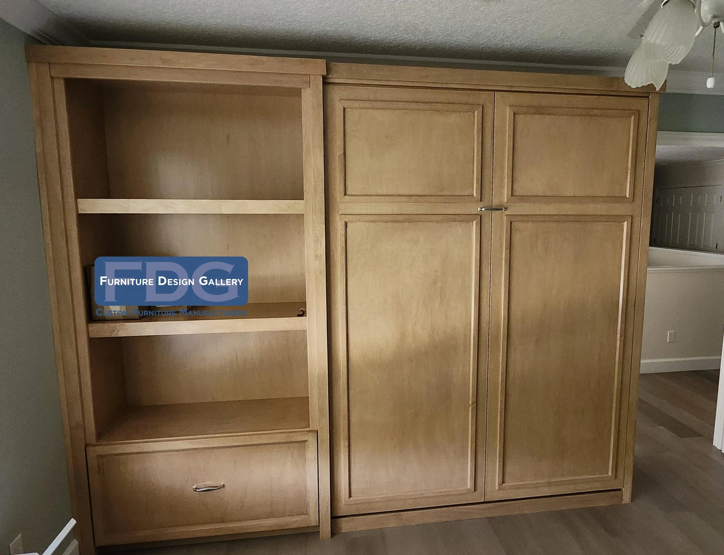 20.  Bespoke Wall Bed Unit | Multifunctional guest room solution featuring a fold-down Murphy bed paired with open shelving and lower drawer storage.