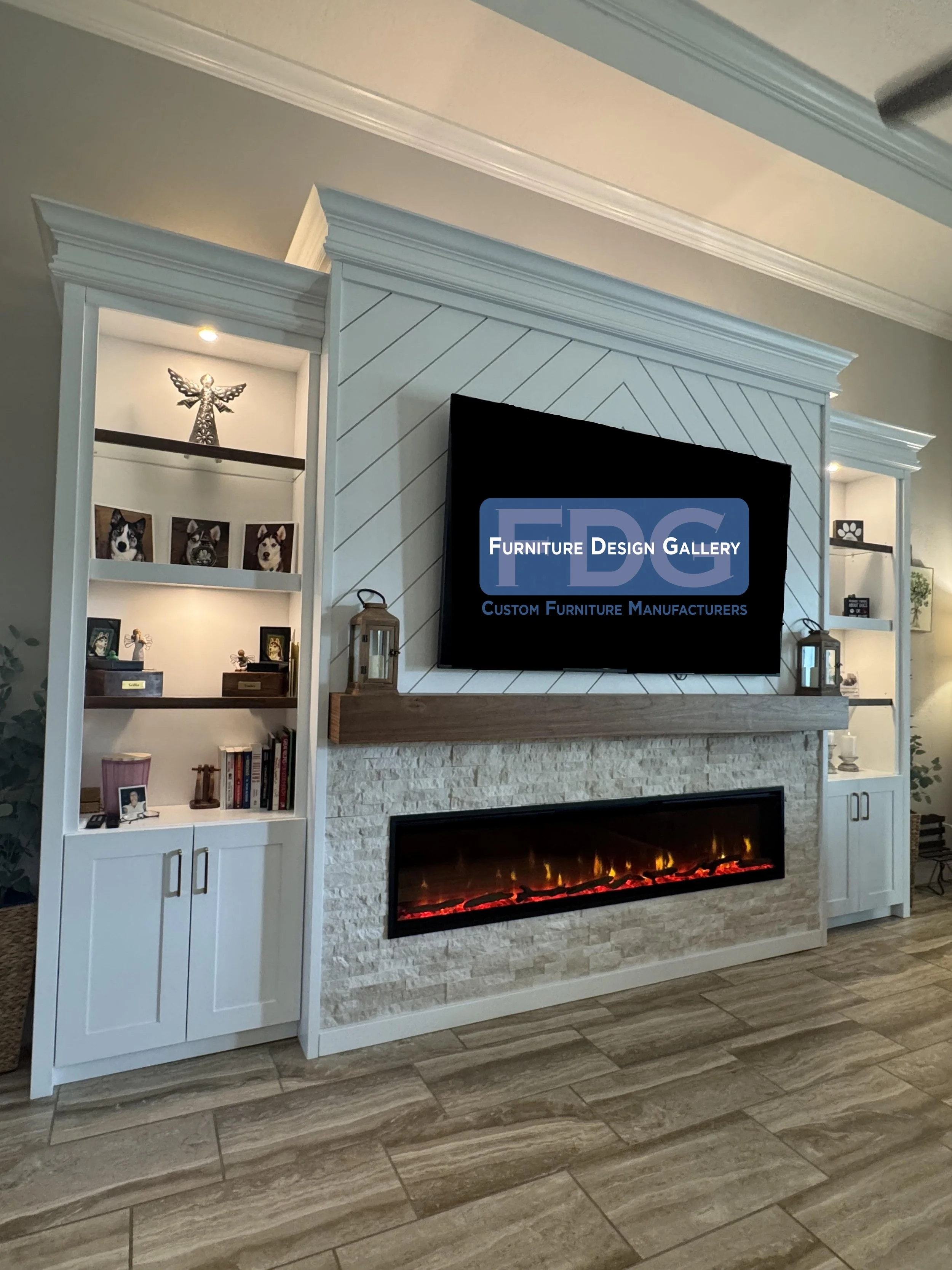72.  Transform your living space with a statement custom entertainment center. This classic design pairs a striking chevron shiplap backdrop and stacked stone accents with a warm wood mantel, an integrated linear fireplace, and illuminated glass disp