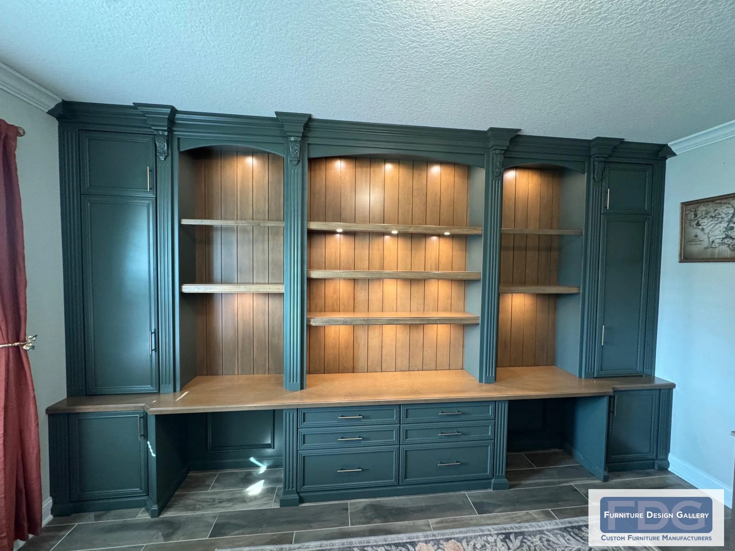8. Deep forest green meets warm wood tones in this stunning custom home office. Ornate fluted columns and integrated task lighting create a workspace that is as inspiring as it is organized.