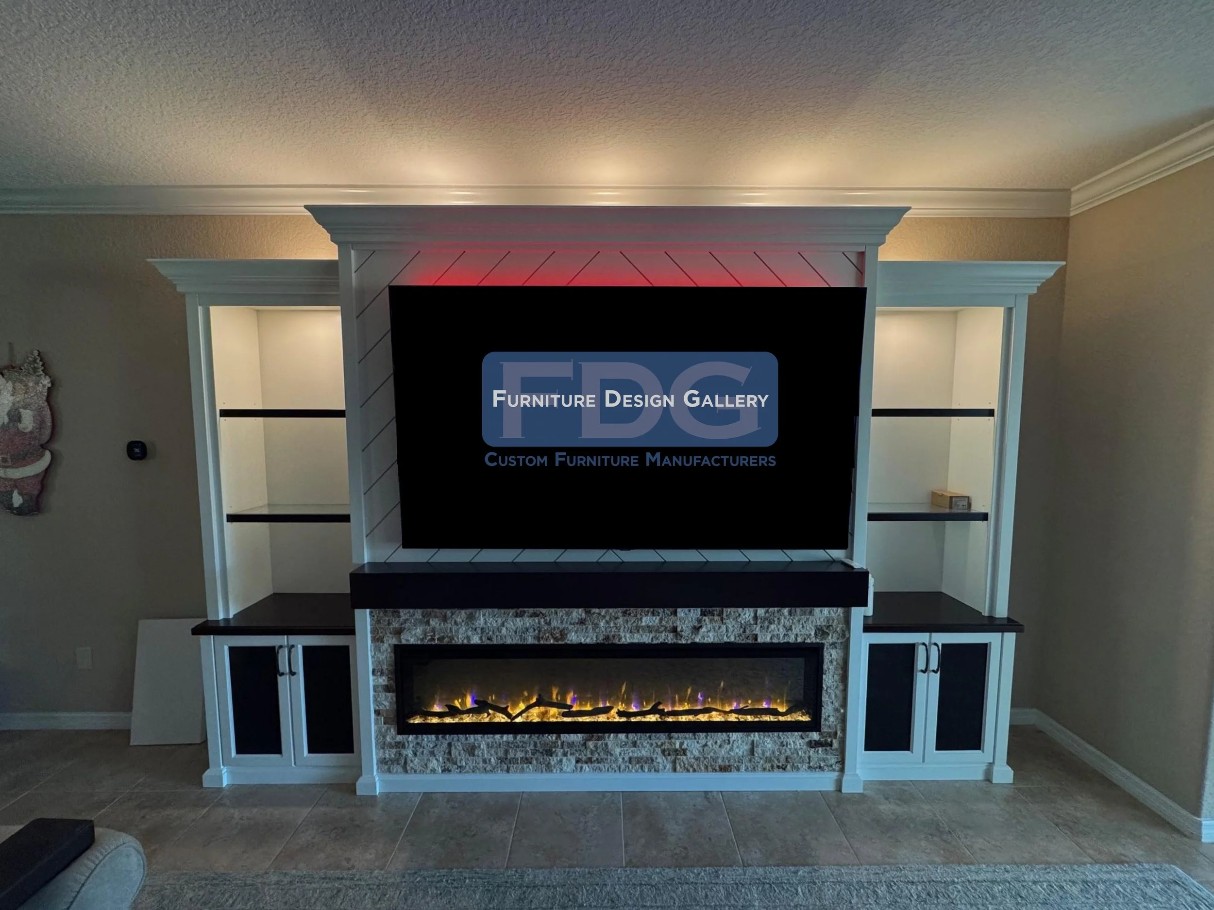 33. A sophisticated centerpiece featuring a built-in electric fireplace, stone accents, and integrated LED lighting for the ultimate cozy-meets-modern aesthetic.
