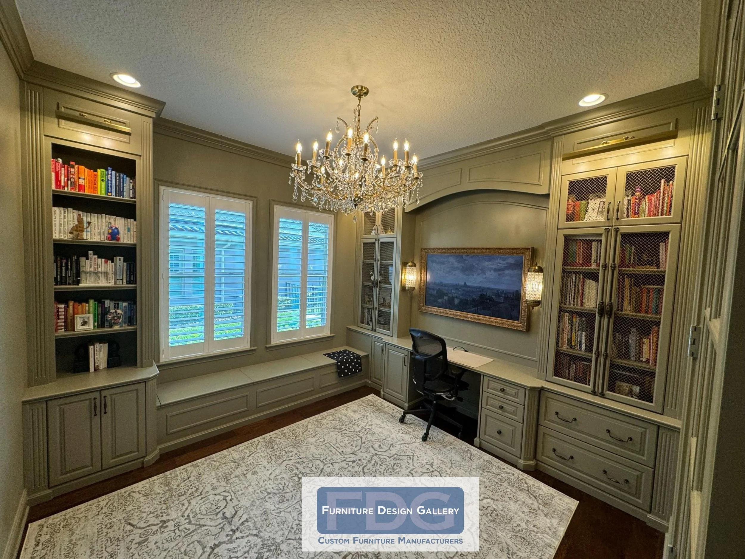 9. An exquisite study in sage and gold. This wrap-around home office features custom wire-mesh cabinetry, a cozy window seat, and a grand chandelier for a truly elevated work-from-home experience.