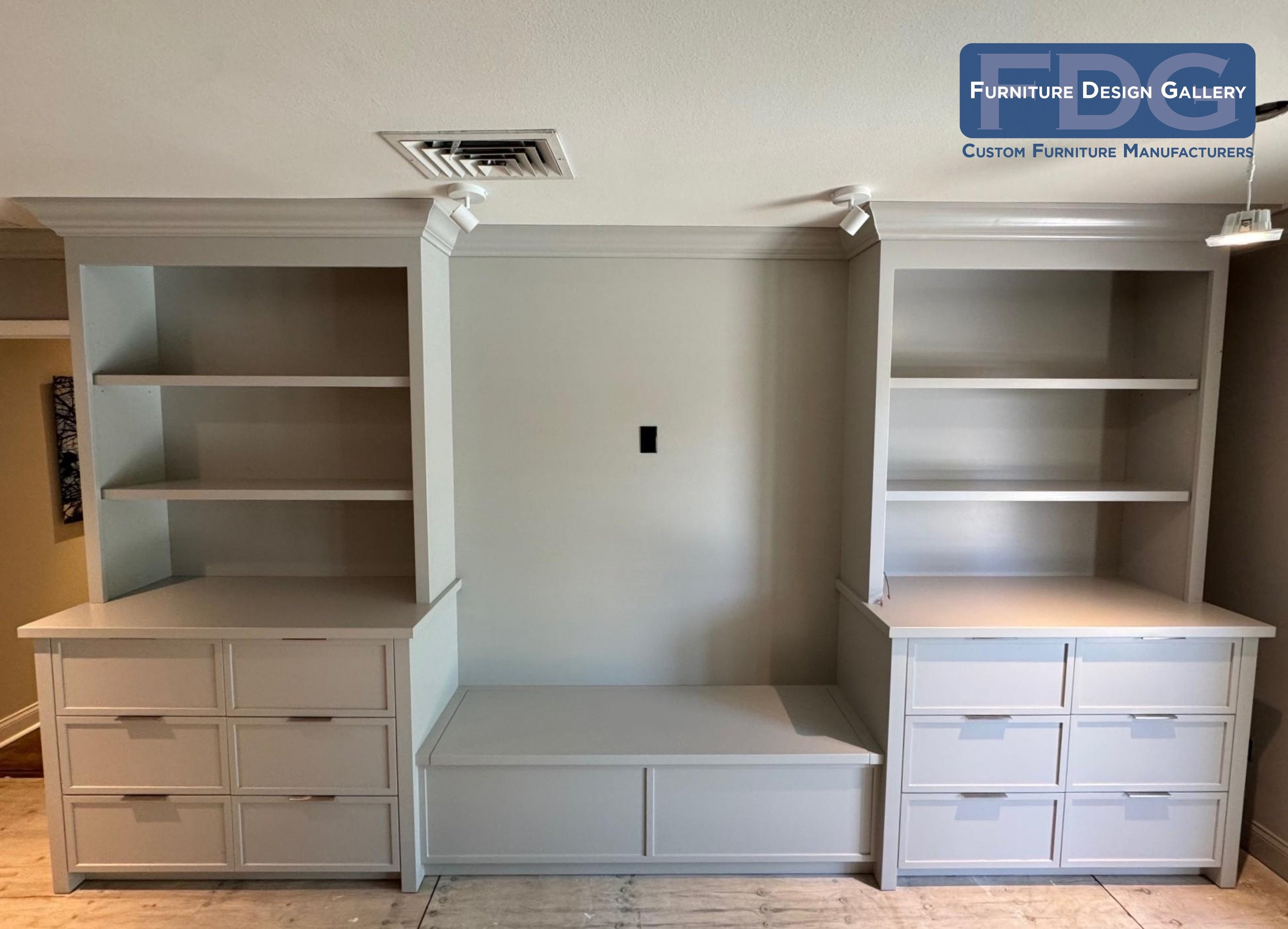 21.  Clean, modern built-in design with open display shelves, deep drawer storage, and TV wall integration.