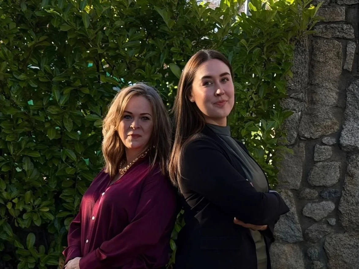 Helen Grant and Shauna Byrne from Diolta Estate Agency, standing back to back.