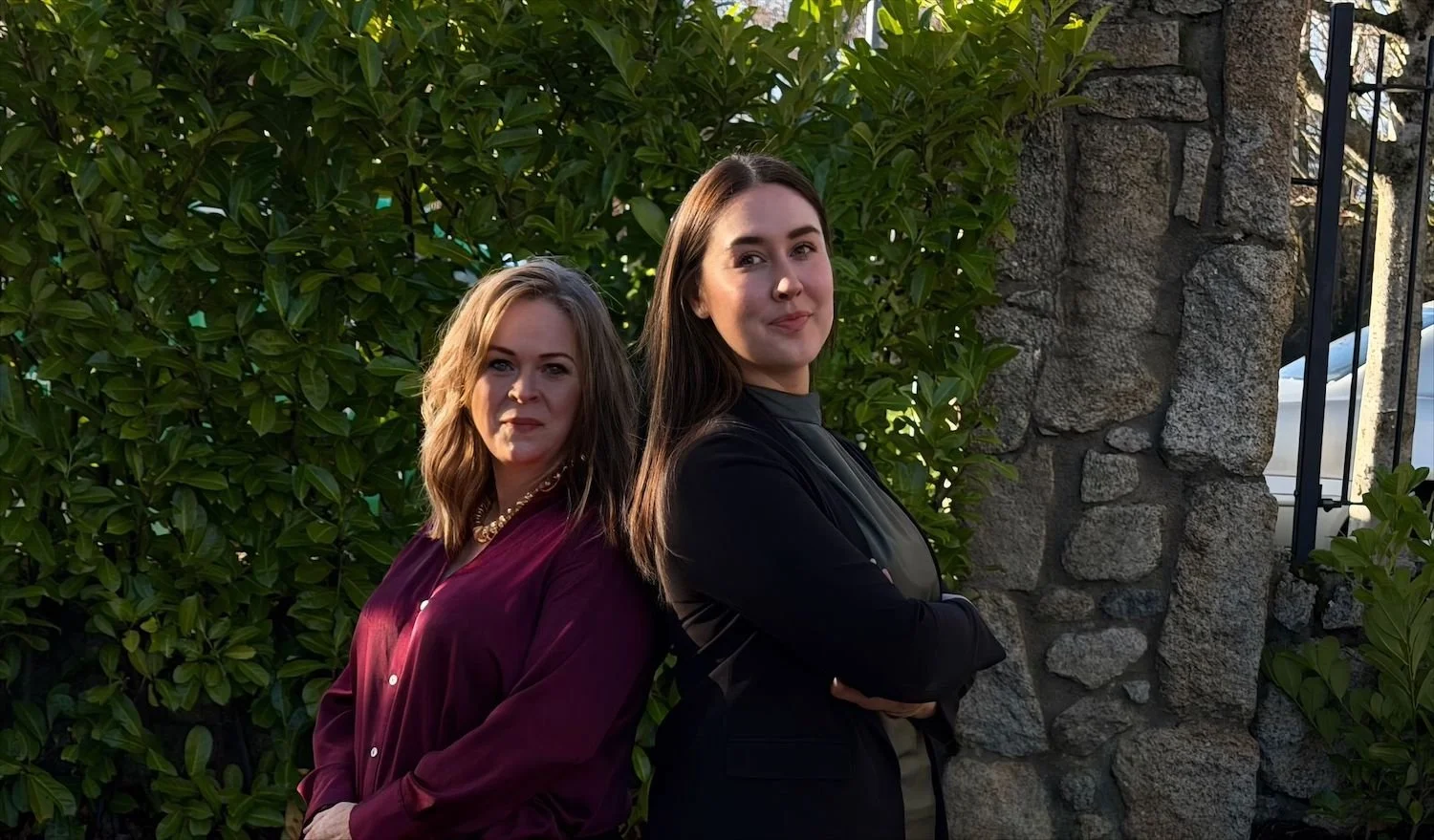 Helen Grant and Shauna Byrne from Diolta Estate Agency, standing back to back