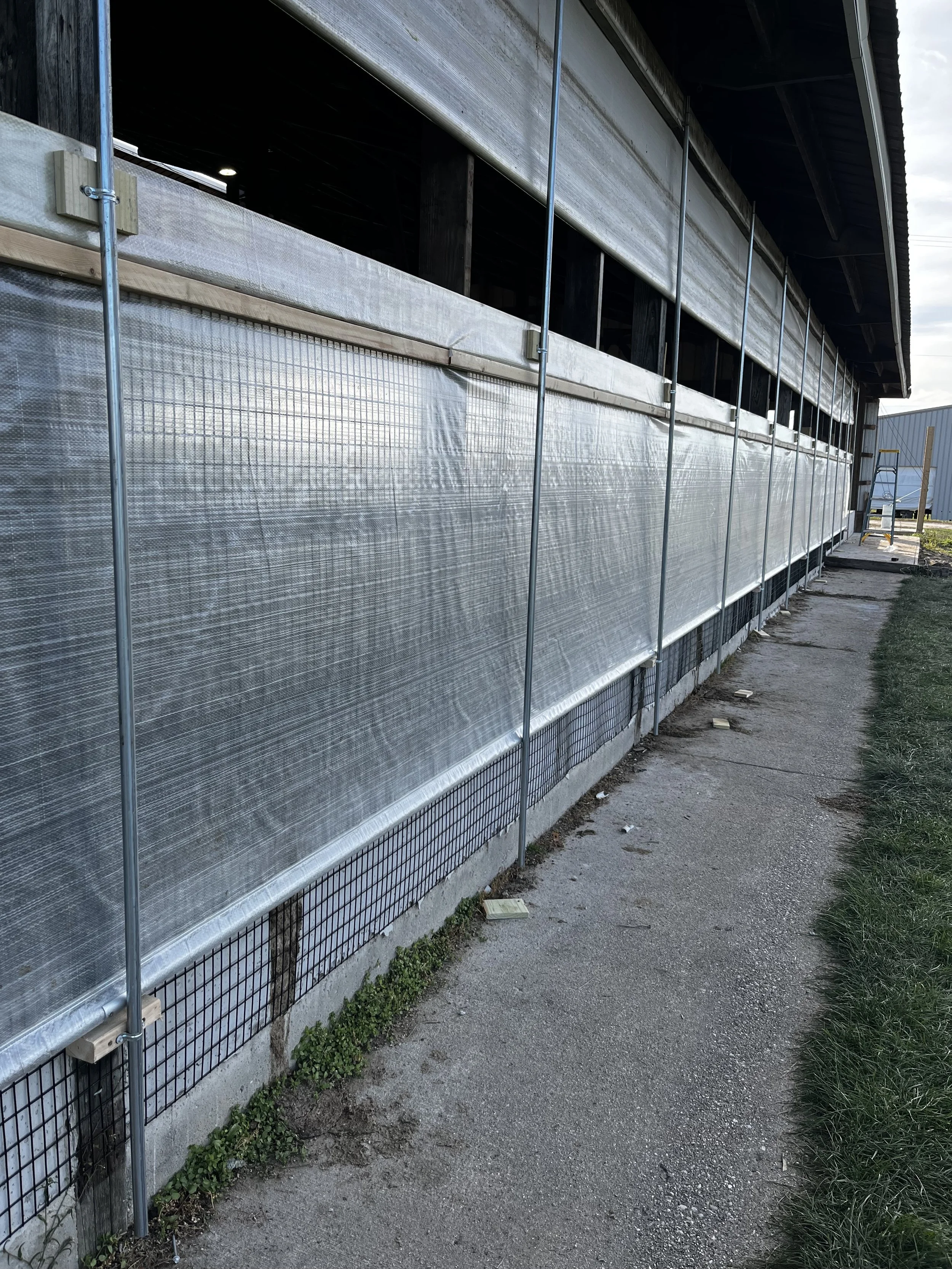 Cattle Barn Curtain Installation in Clare, Michigan | Lowe Maintenance LLC