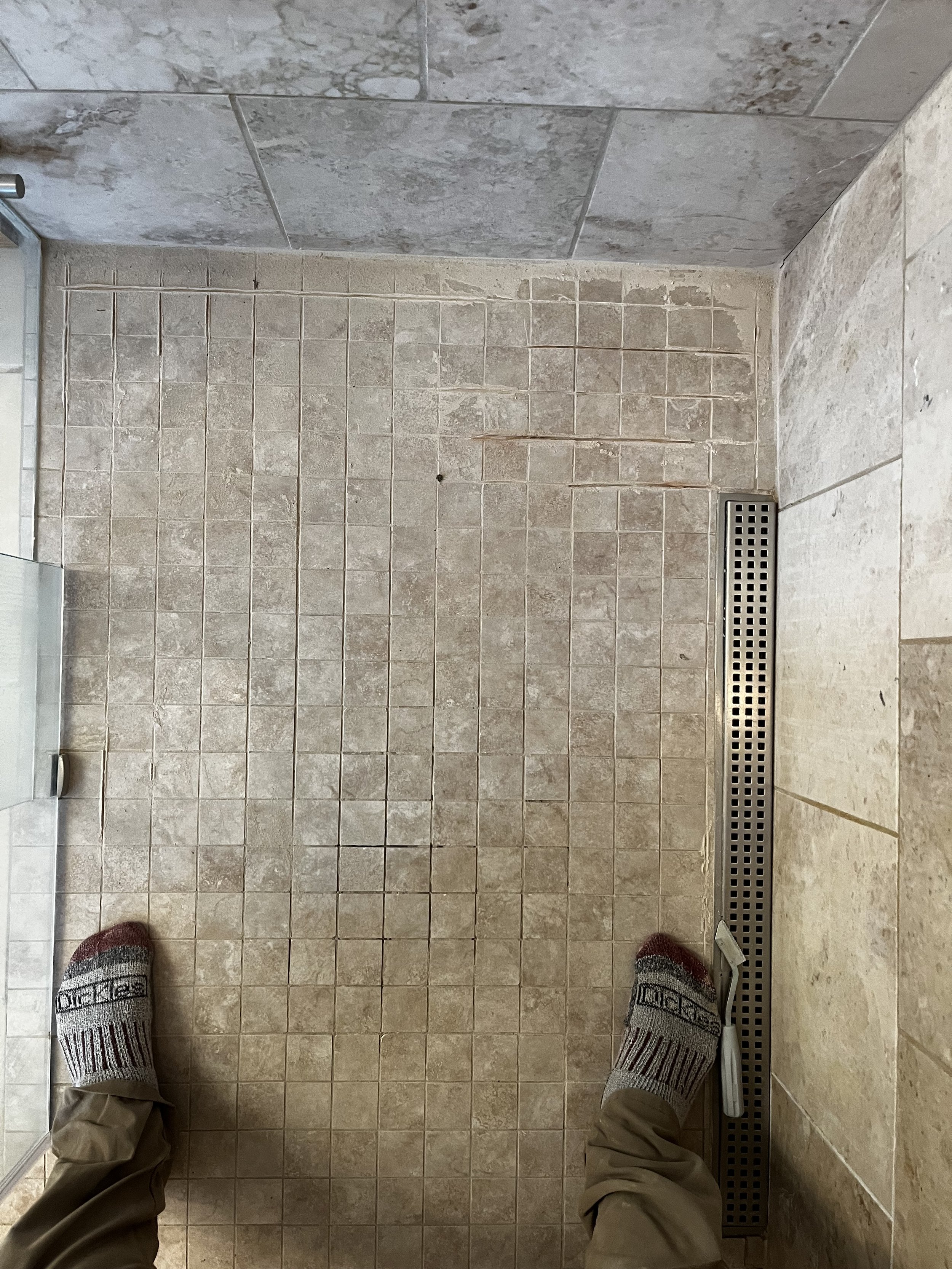 Before picture of a shower tile re-grout job in Mount Pleasant, Michigan.