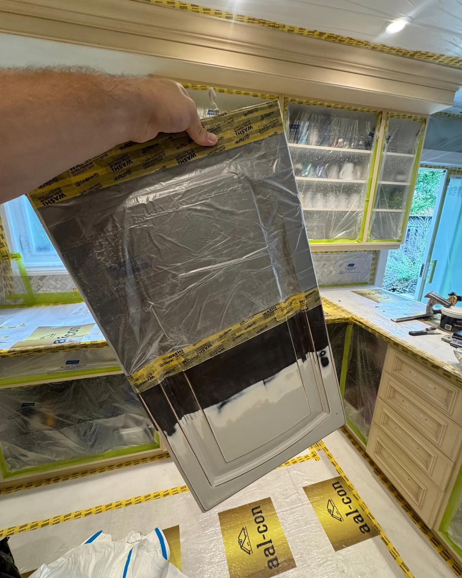 Half old paint, half freshly sanded. This is where the transformation begins.
Prepping the surface properly is the key to a beautiful cabinet finish. Once the sanding is complete, the new color goes on smoothly and looks brand new.

📞Contact Travis 