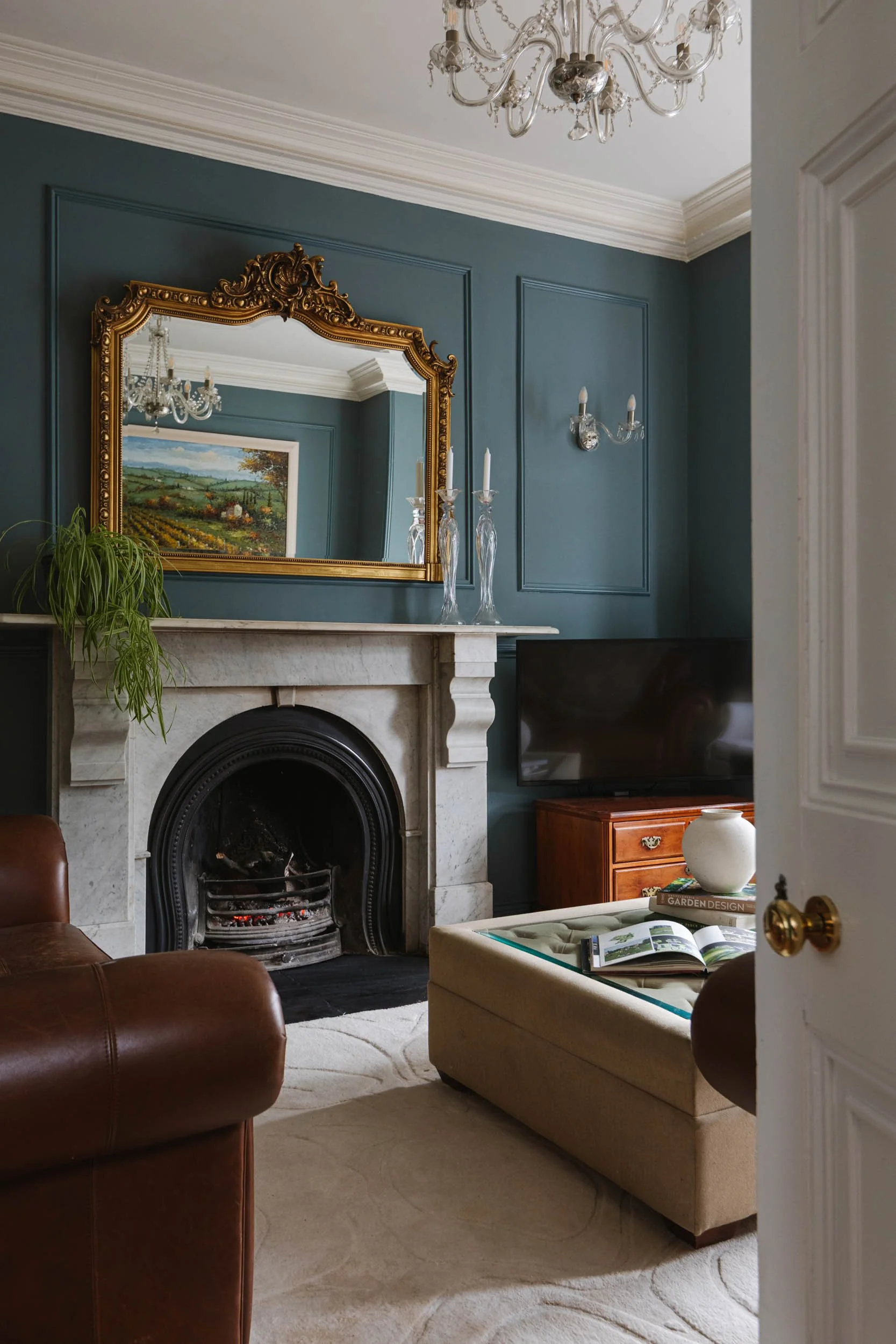 Living room design, rug and custom vintage furniture sourcing