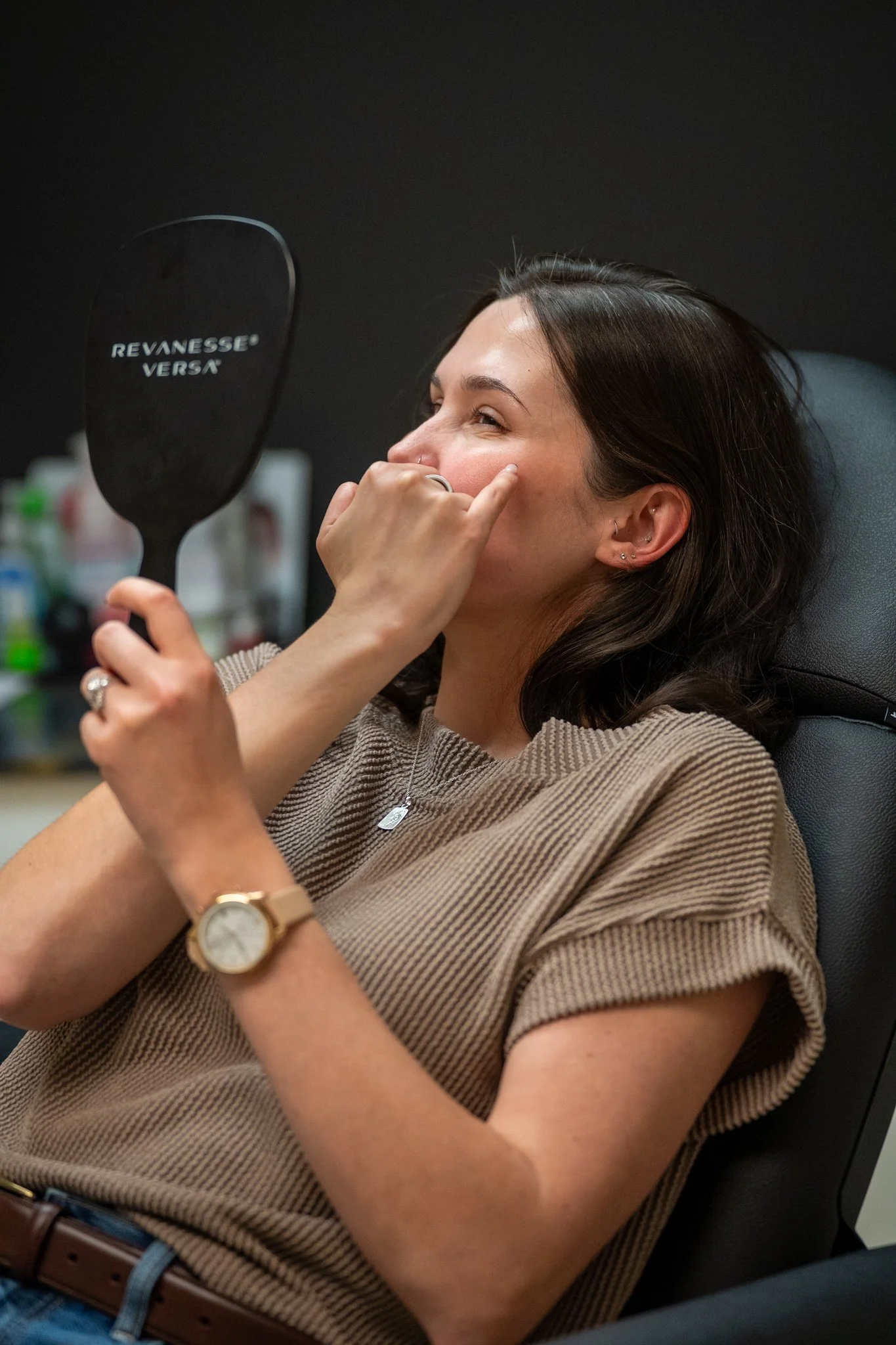 A woman receiving a cosmetic procedure from a professional in a clinic.