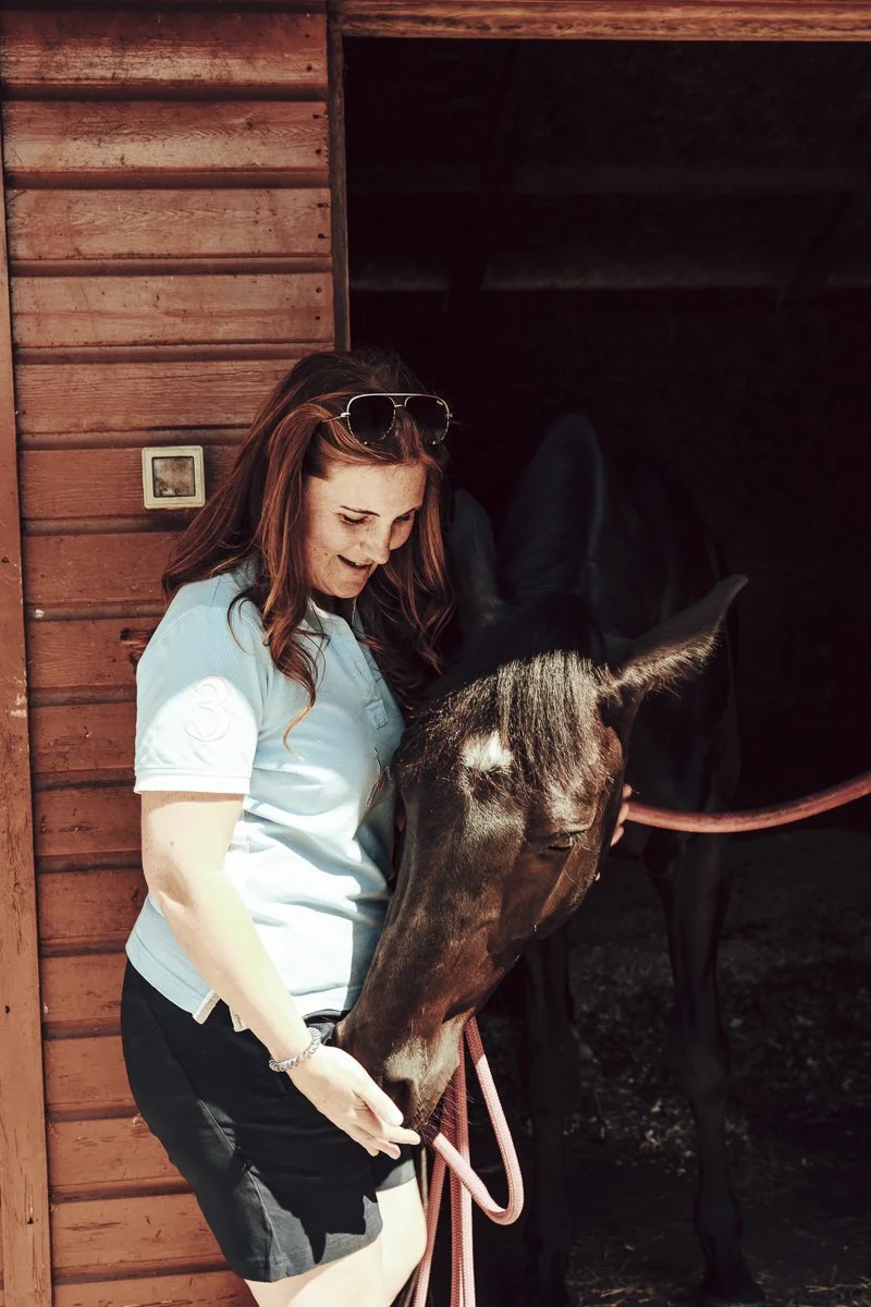 Horse owner with her bay horse at the stable door, a Seven Hills Equine client in Staffordshire