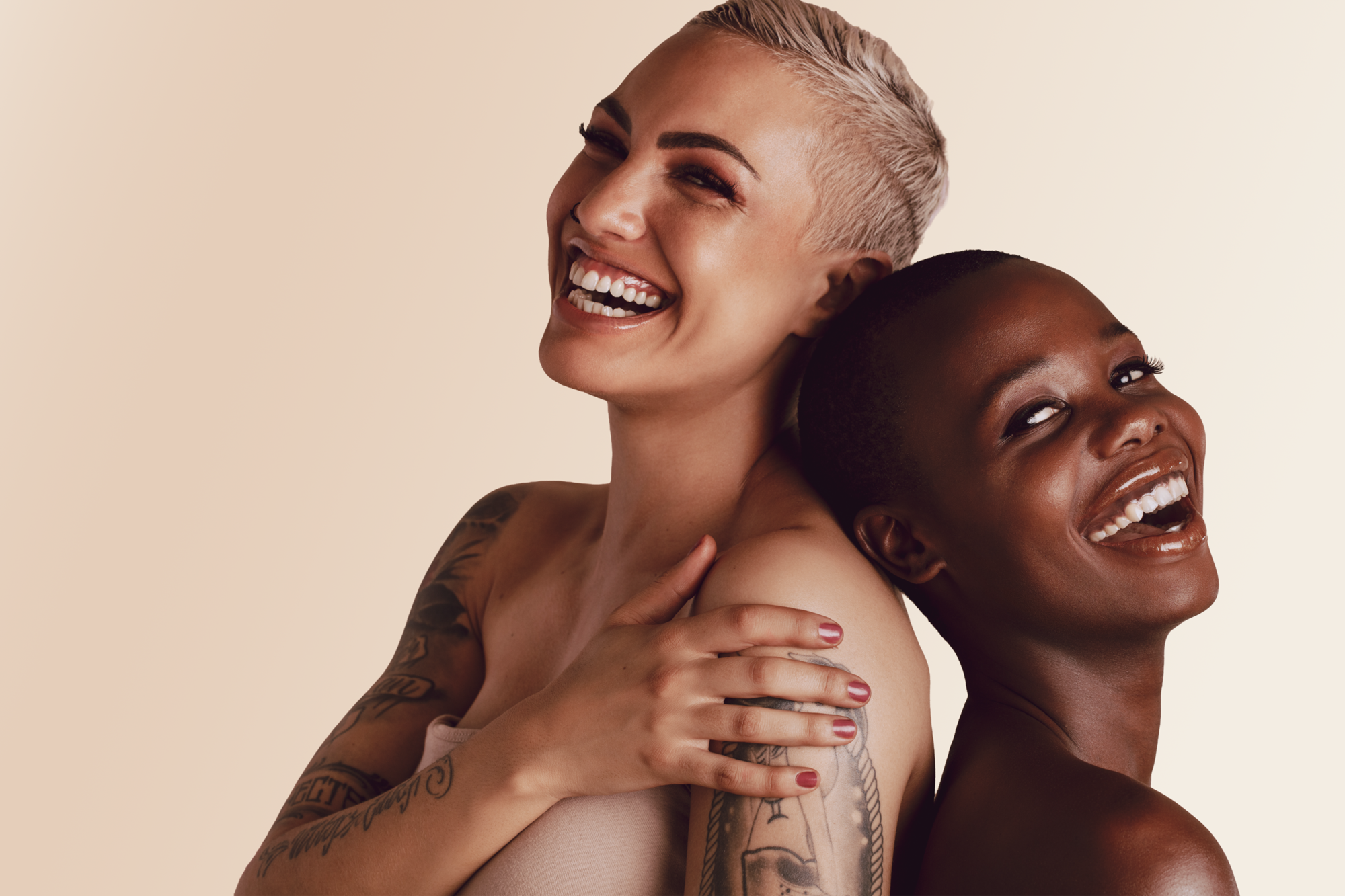 Two-woman-short-hair-tattoos.png