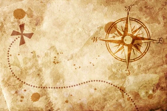 A vintage treasure map with a compass rose in the upper right corner and a dotted path leading to an 'X' marking a location, with an aged parchment background.