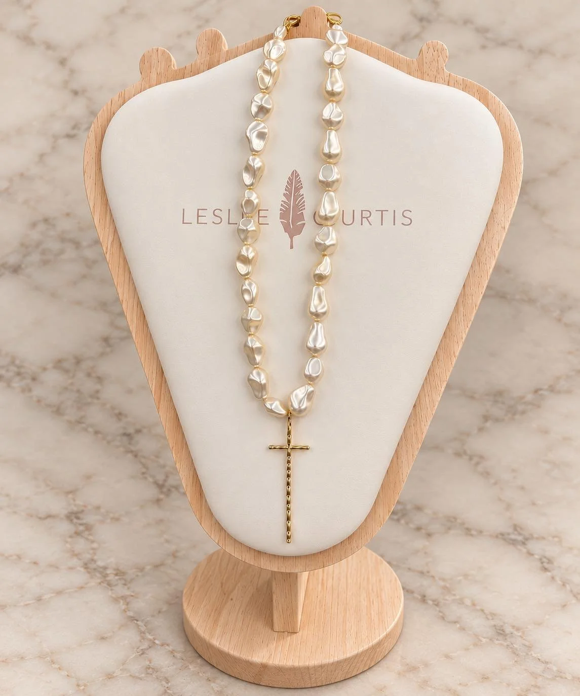 Pearls with a meaningful touch! A beautiful cross necklace from our new fashion jewelry collection by Leslie Curtis! Come shop our new collection today! ✨🤍🤩