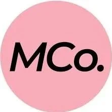 Pink circle with the text 'MCo.' in black letters