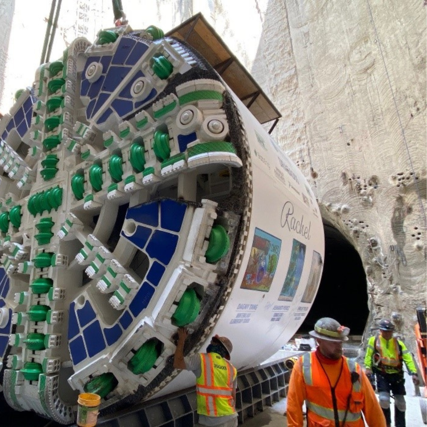 Tunnel boring machine Rachel assembled at the bottom of the access shaft with mining staff present.