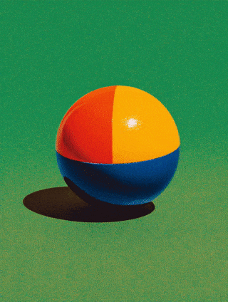 Colorful beach ball on green background