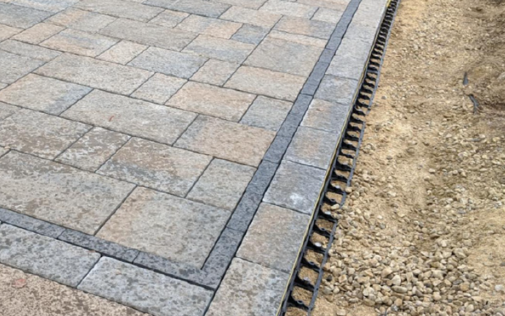 Snap edging on a paving stone patio and secured with 12 inch spikes