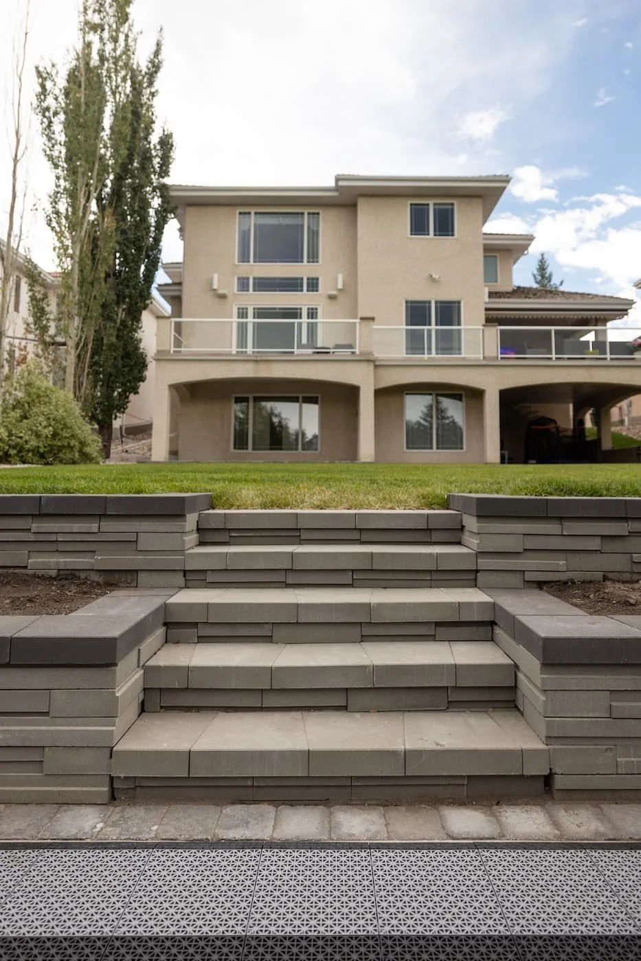 Custom Graphix steps and retaining wall with garden boxes