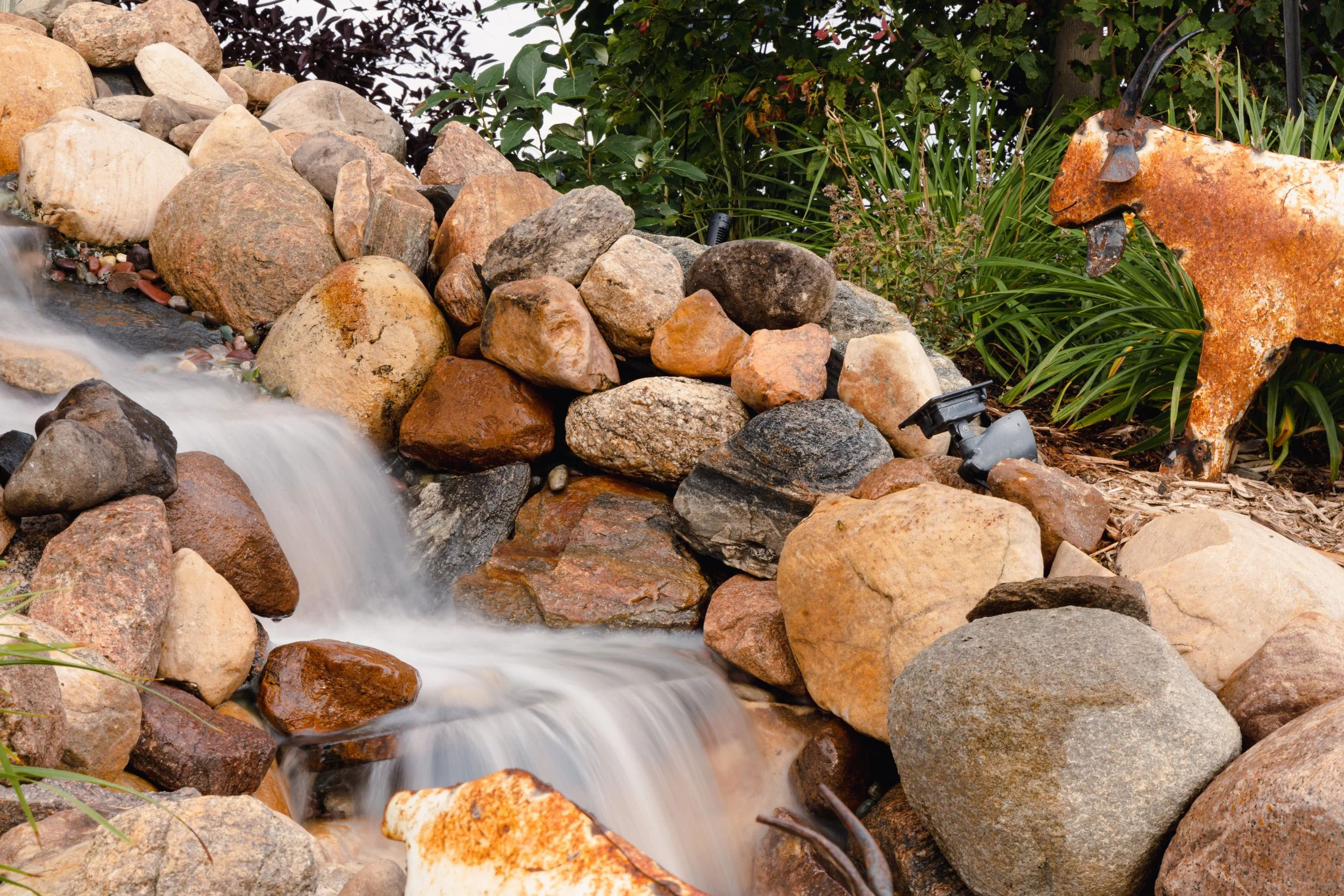 Why Blue Isle Landscaping Builds the Best Pondless Water Features for Edmonton’s Climate