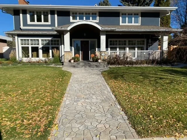 Rustic paving stone walkway leading to a front door