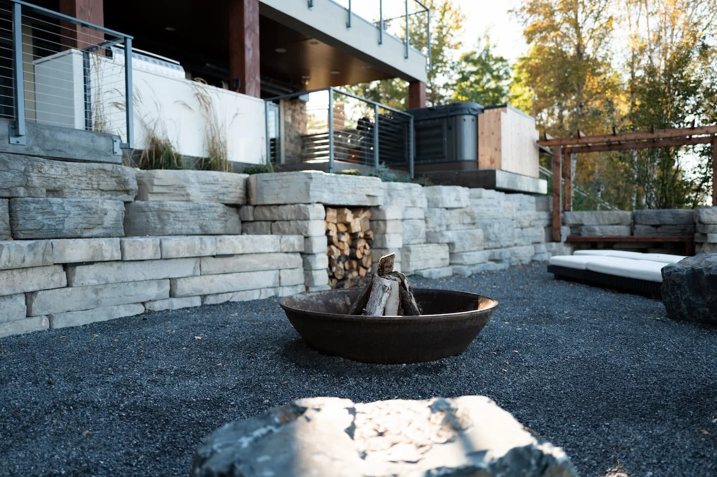 A wood burning cone crusher fire pit at a beautiful lake front property