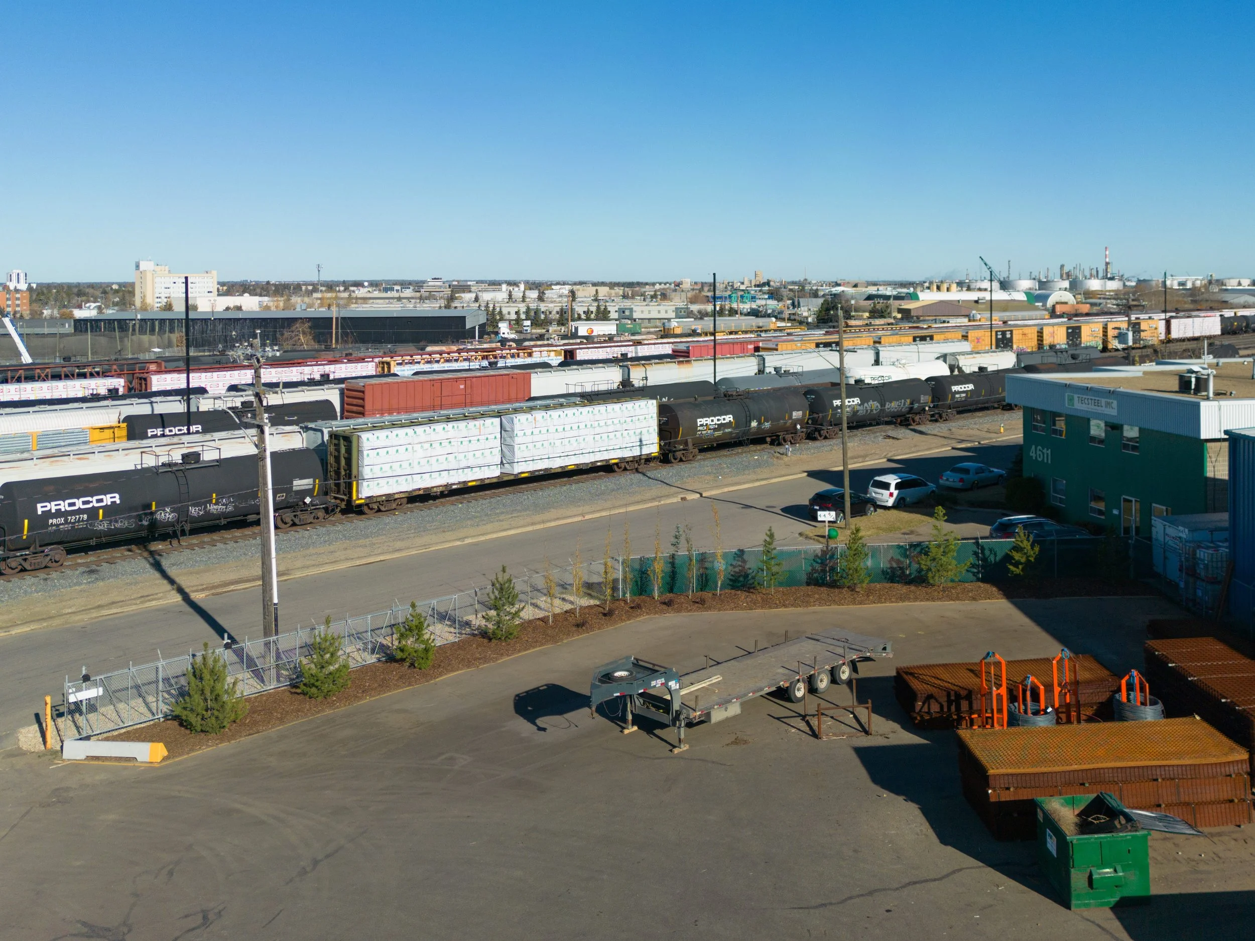 Commercial landscaped yard with mulch beds and trees