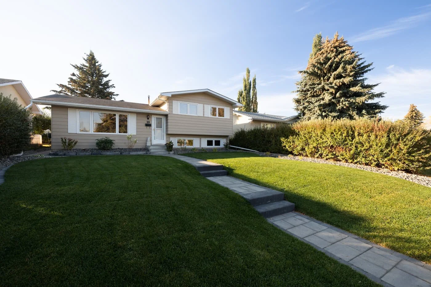 Walkway and steps leading up to a front door using paving stones and step blocks
