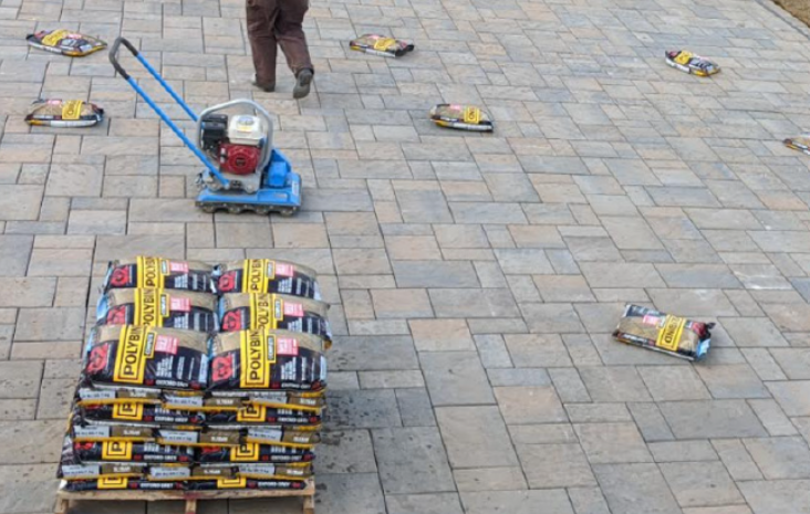 polysand being put into patio joints