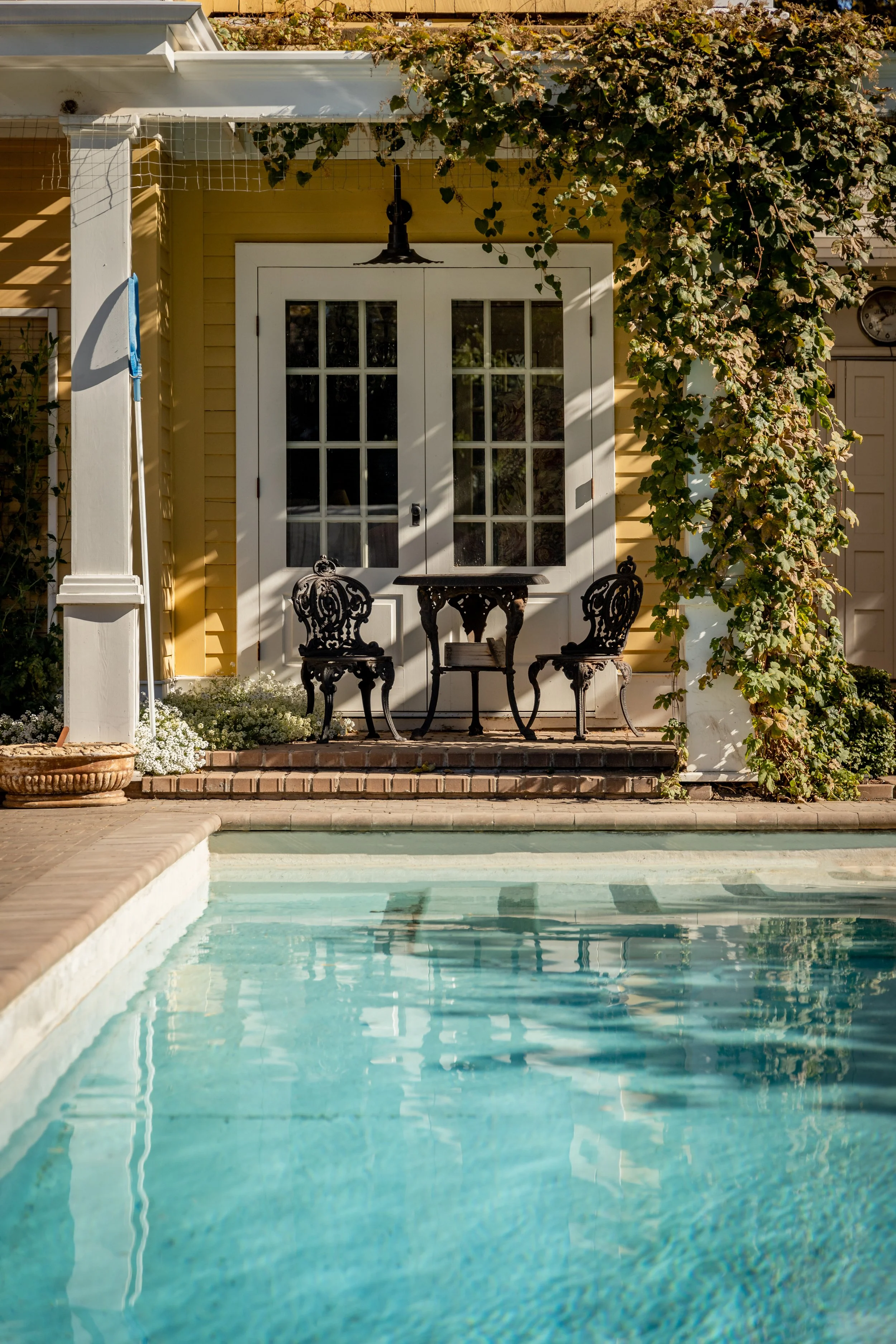Custom paving stone pool deck surrounding a pool in Edmonton