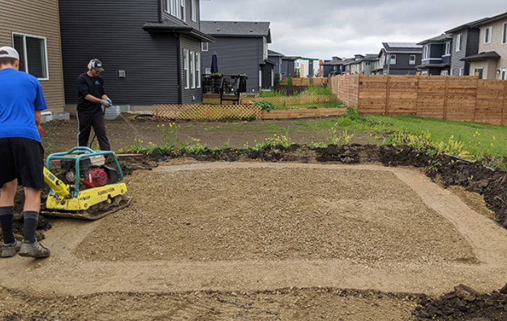 Road crush patio base being tamped