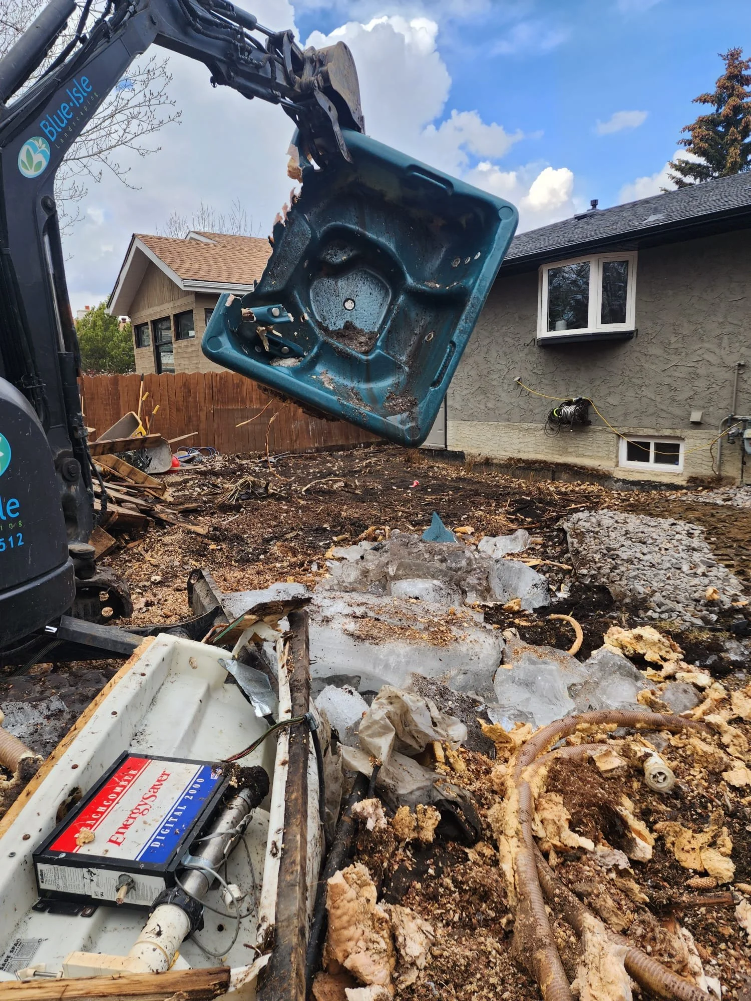 Demolition of a backyard using an excavator