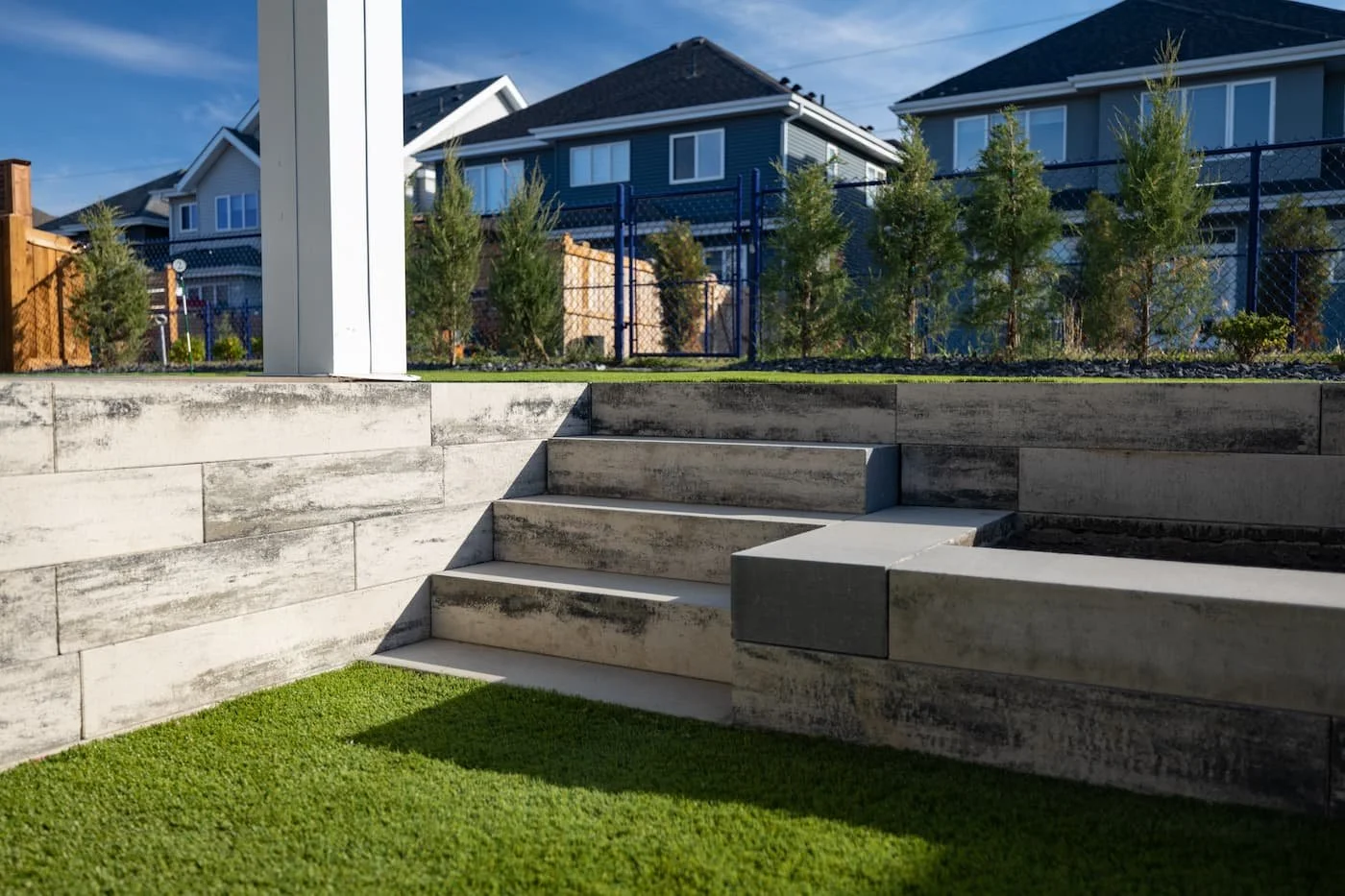 Architextures retaining wall box in sterling grey grading backyard and creating a garden box