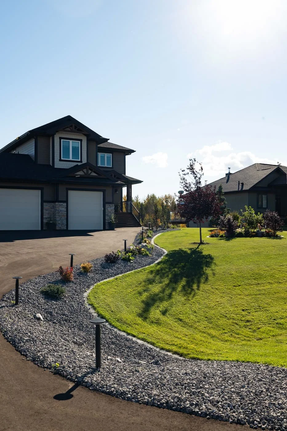 Pathway lighting leading up a driveway to your front door